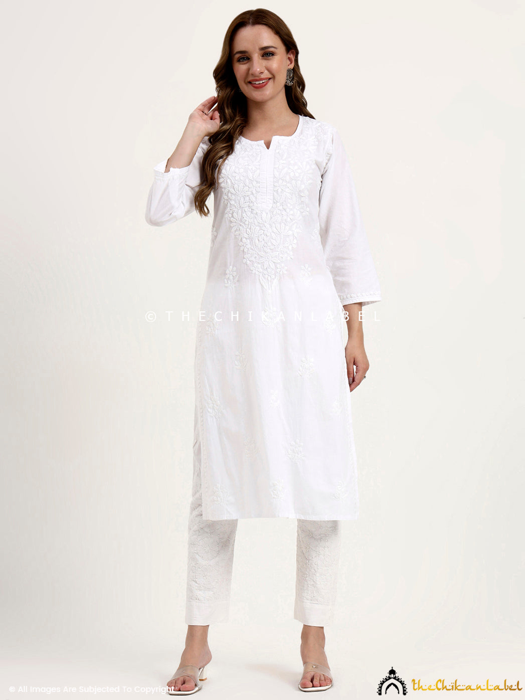 Elegant cotton chikankari kurti with straight fit and intricate hand embroidery for festive and office wear.