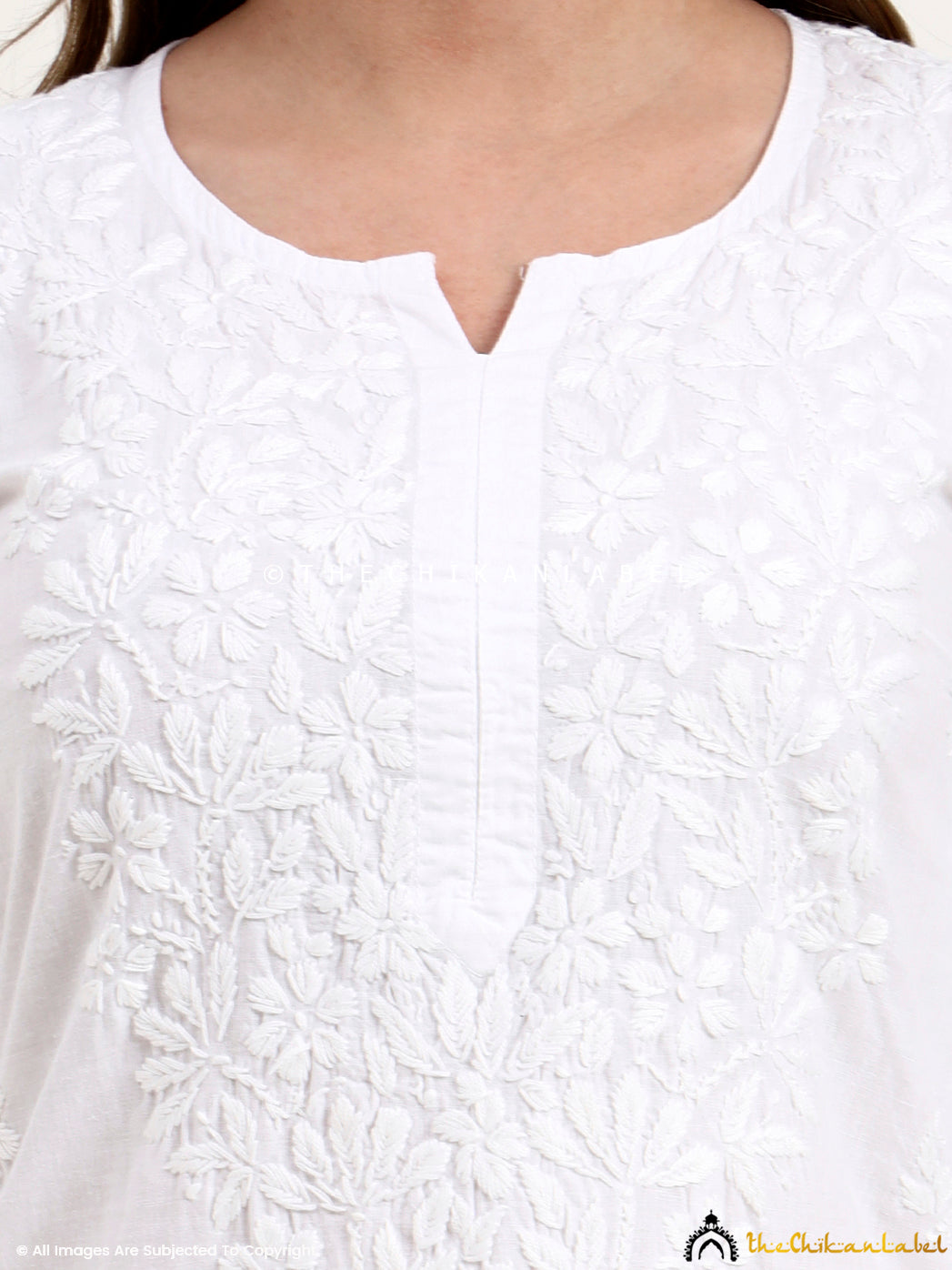 Authentic Lucknowi chikankari kurti crafted from breathable cotton fabric with detailed floral embroidery.