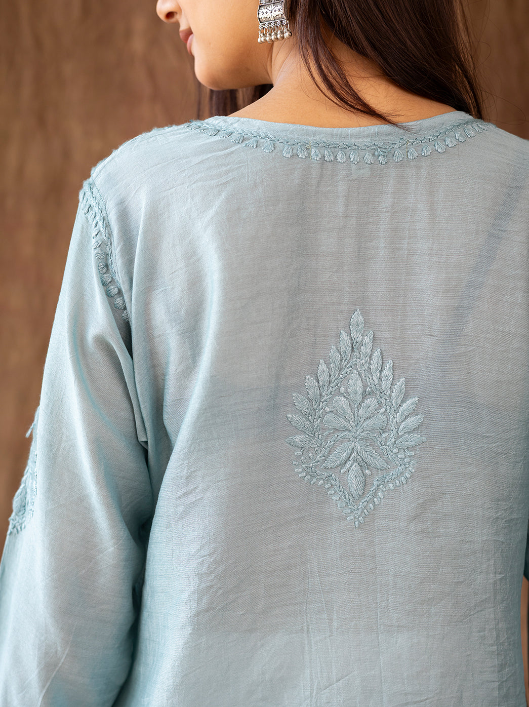 Premium hand embroidered chikankari kurti set designed with a straight silhouette and wide farshi salwar for timeless ethnic styling