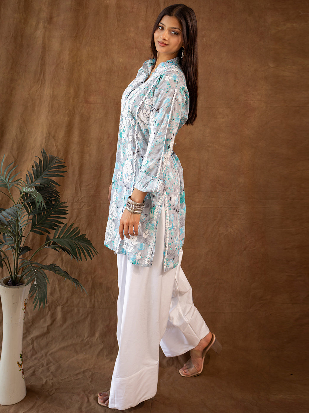 Elegant Lucknowi chikankari kurta set highlighting all-over hand embroidery, breathable mulmul fabric, and classic farshi salwar fit