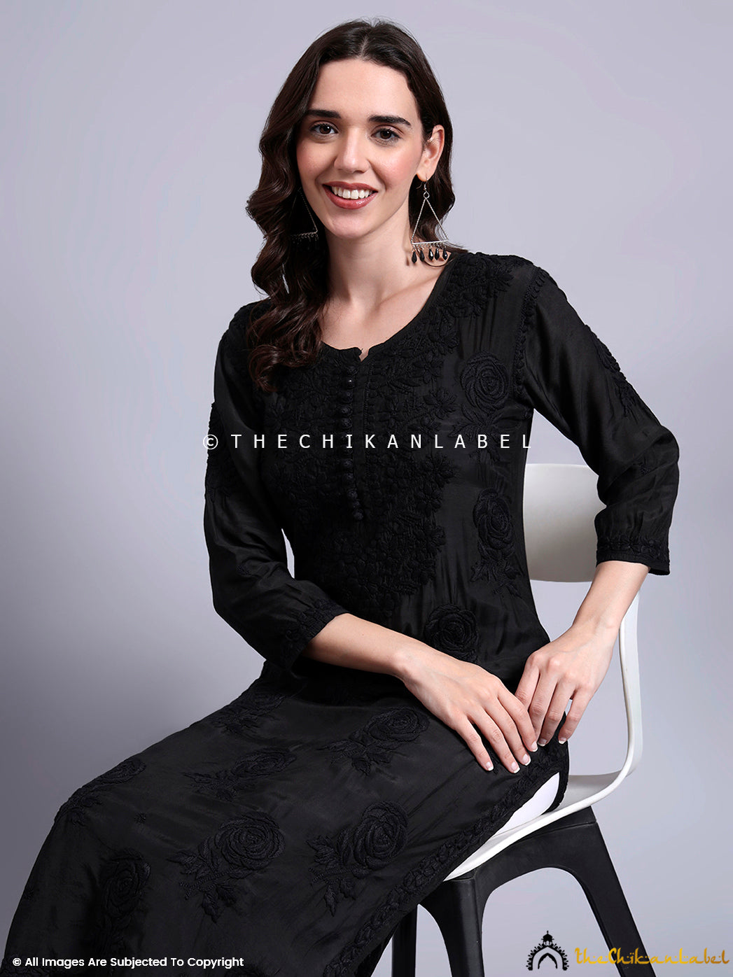 Indo-ethnic fusion look featuring a lightweight muslin kurti with full-length embroidery on the front panel, ideal for semi-formal occasions.

