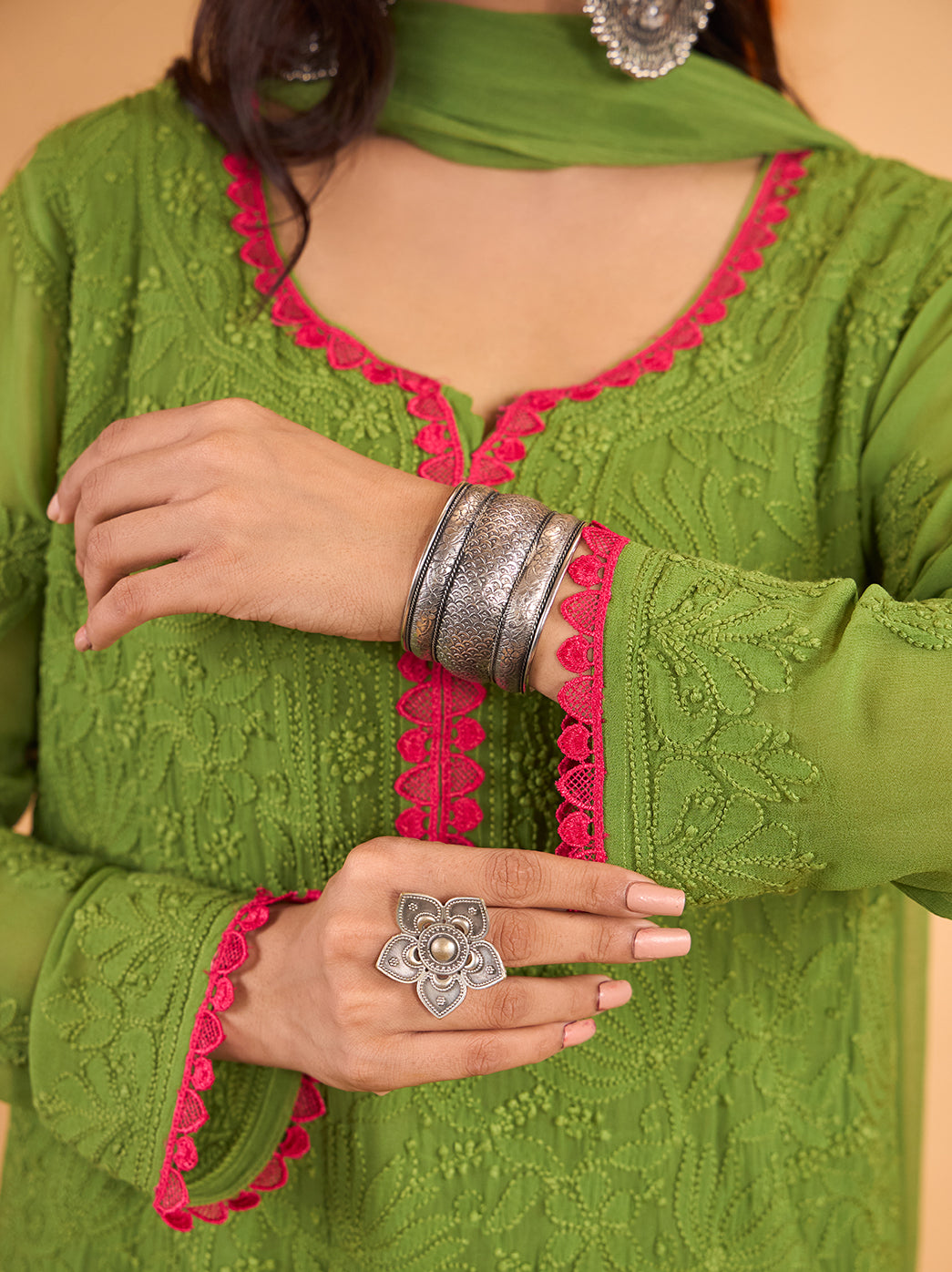 Gulnaar embroidered viscose kurti with a gently curved split neckline framed by decorative lace, paired with coordinating palazzo pants and a dupatta.