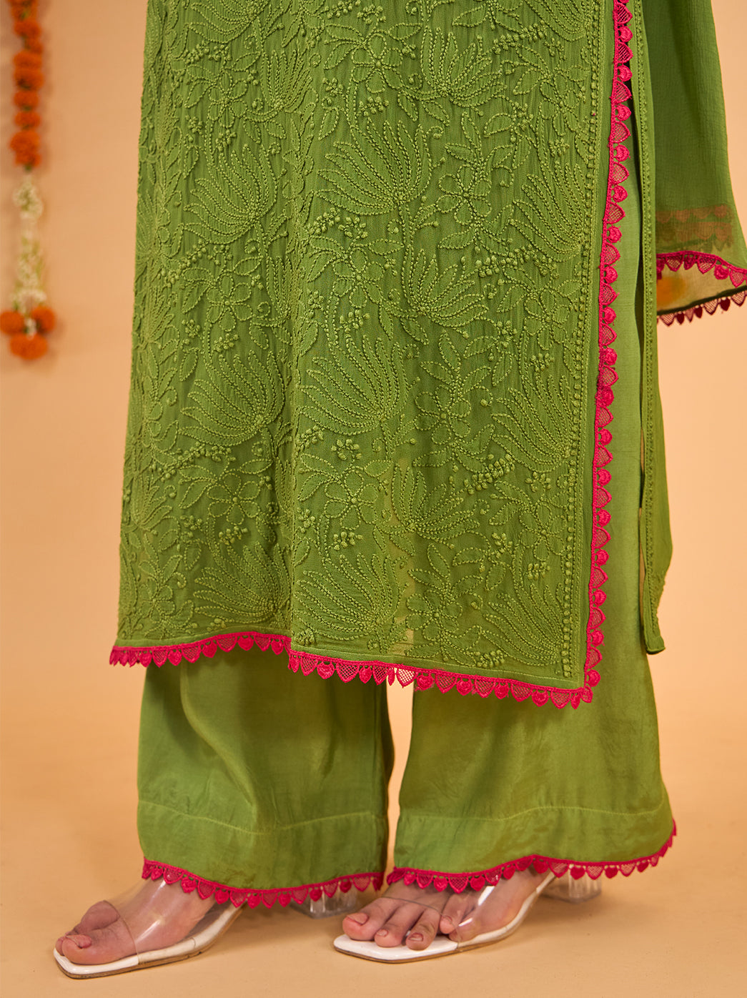 Gulnaar comfortable festive wear set displayed in a full-length model photograph, showing the straight kurti cut, embroidered sleeves and coordinated palazzo silhouette.