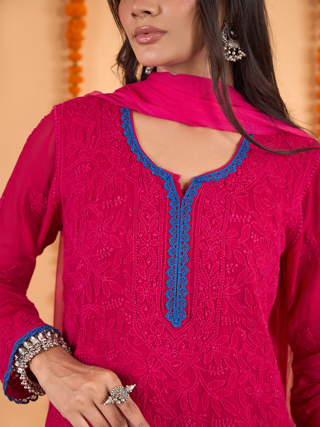Full-length Gulnaar kurti palazzo set with dupatta, showing the elongated straight silhouette, embroidered front and lace detailing along the kurti hem.

