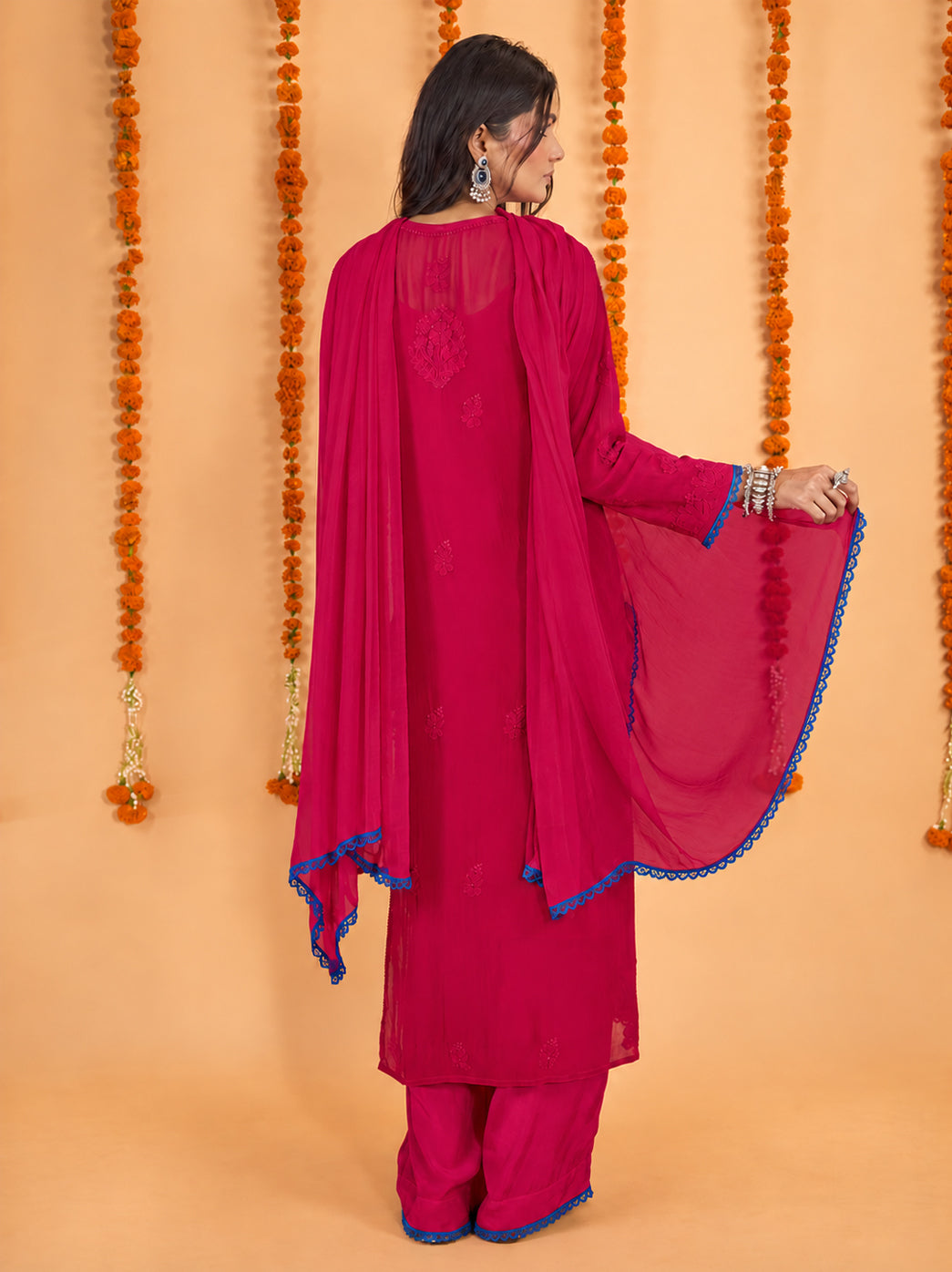 Gulnaar viscose Chikankari kurti featuring leafy vines and floral threadwork, paired with coordinating palazzo pants for a complete three-piece ethnic ensemble.