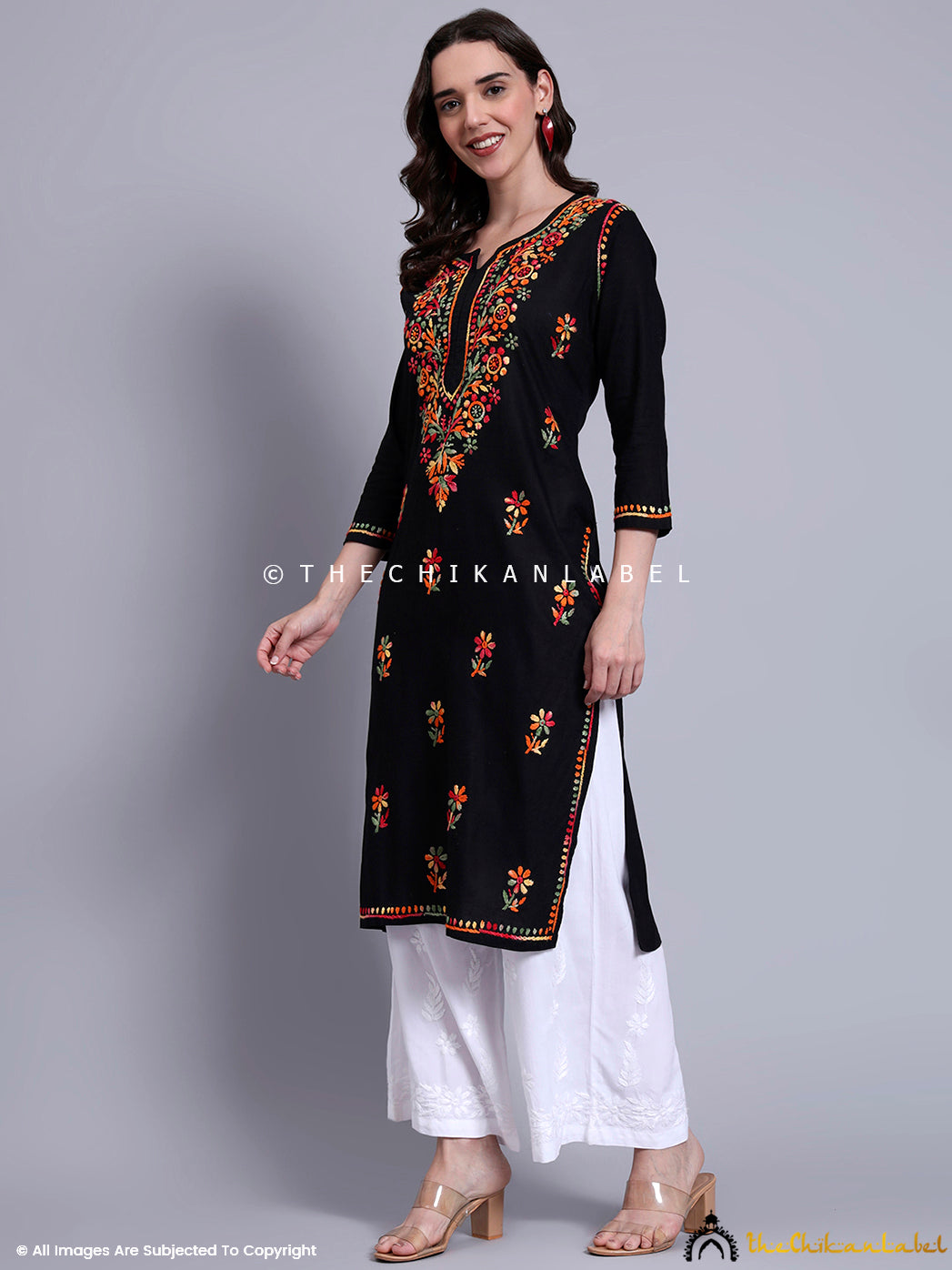 Traditional cotton kurti with multicolored embroidery in floral motifs and straight fit, ideal for festive wear and office ethnic days.

