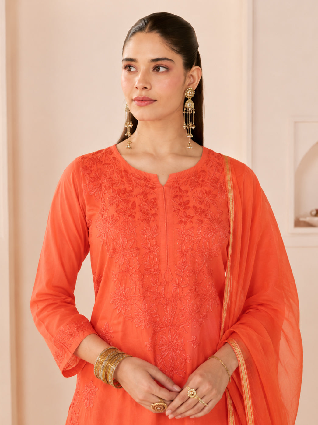 Full-length view of Hanshika Chanderi Kurta Set with Dupatta featuring an embroidered straight kurti, comfortable pants and matching dupatta for elegant occasion wear.