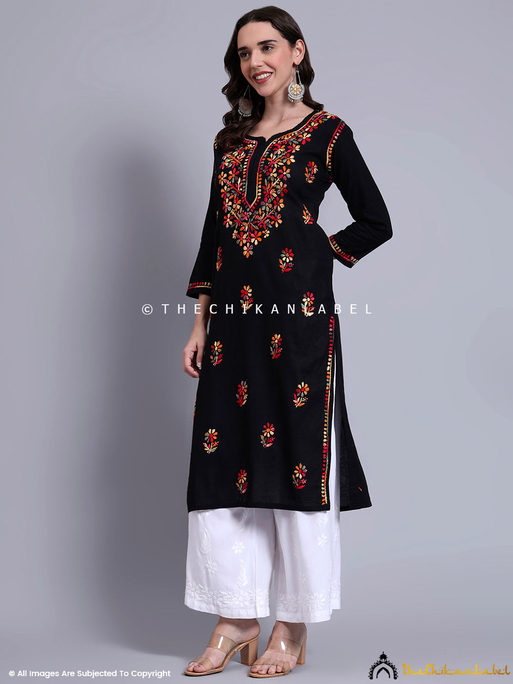 Traditional cotton kurti with multicolored embroidery in floral motifs and straight fit, ideal for festive wear and office ethnic days.

