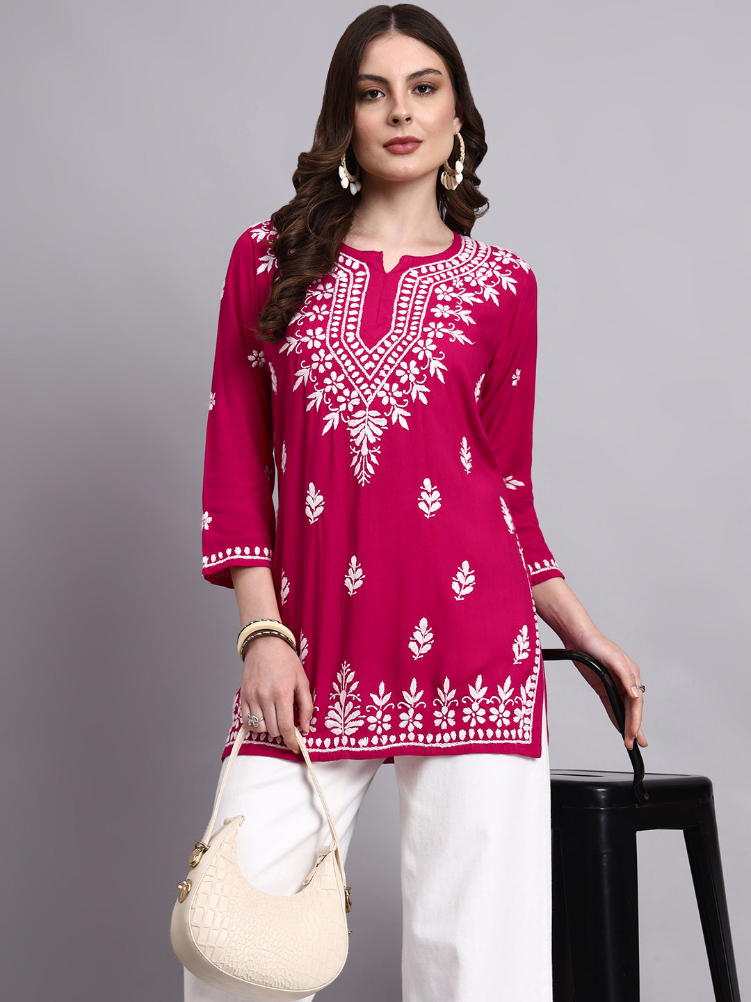 Artisan-made chikankari short kurta with elegant embroidery detailing on neckline and borders