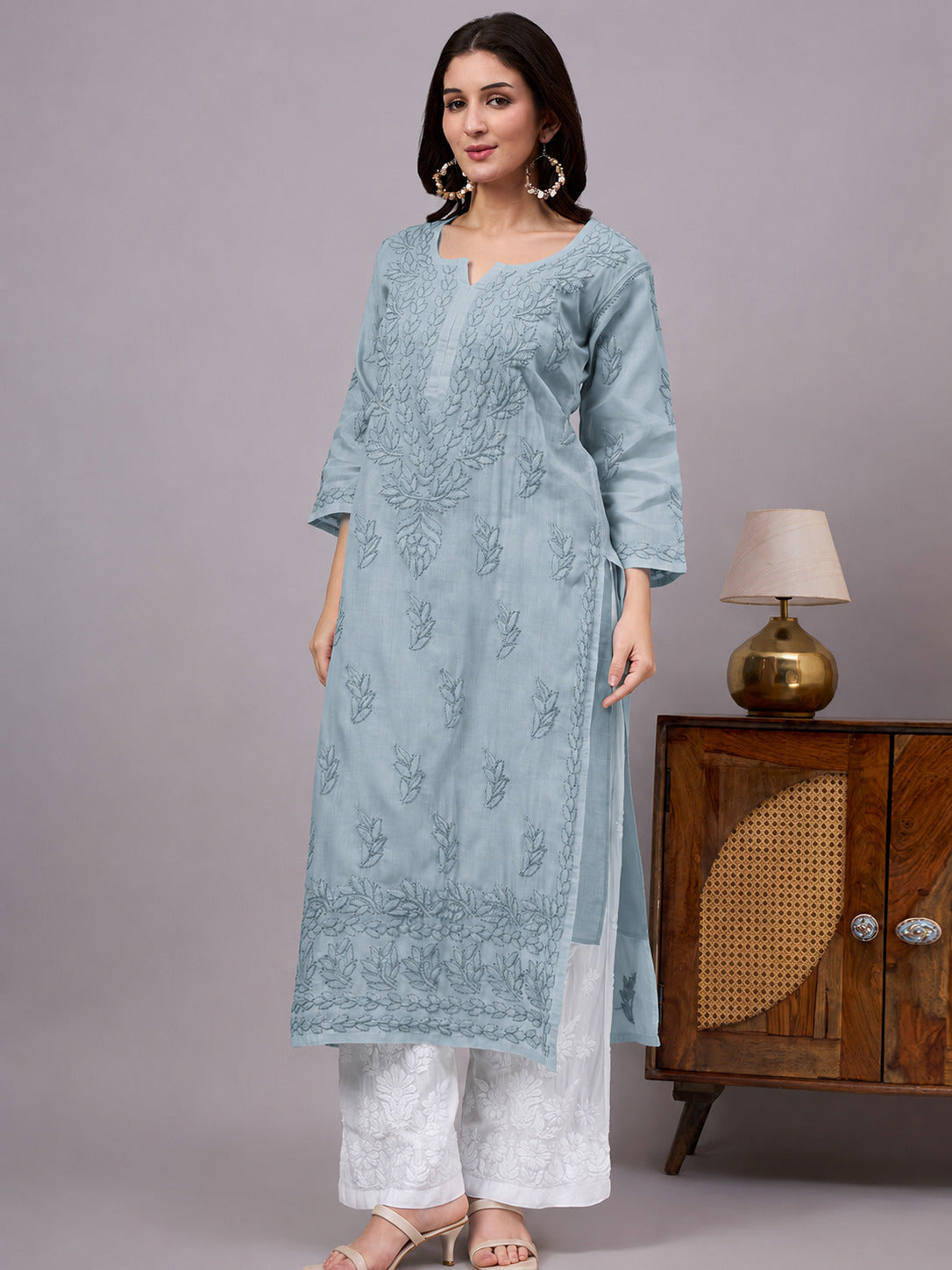 Women's handcrafted Chikankari Kurta made from breathable cotton fabric with detailed artisan embroidery and a comfortable regular fit for every occasion.