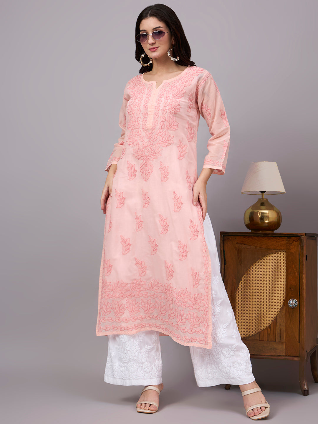 Women's handcrafted Chikankari Kurta made from breathable cotton fabric with detailed artisan embroidery and a comfortable regular fit for every occasion.