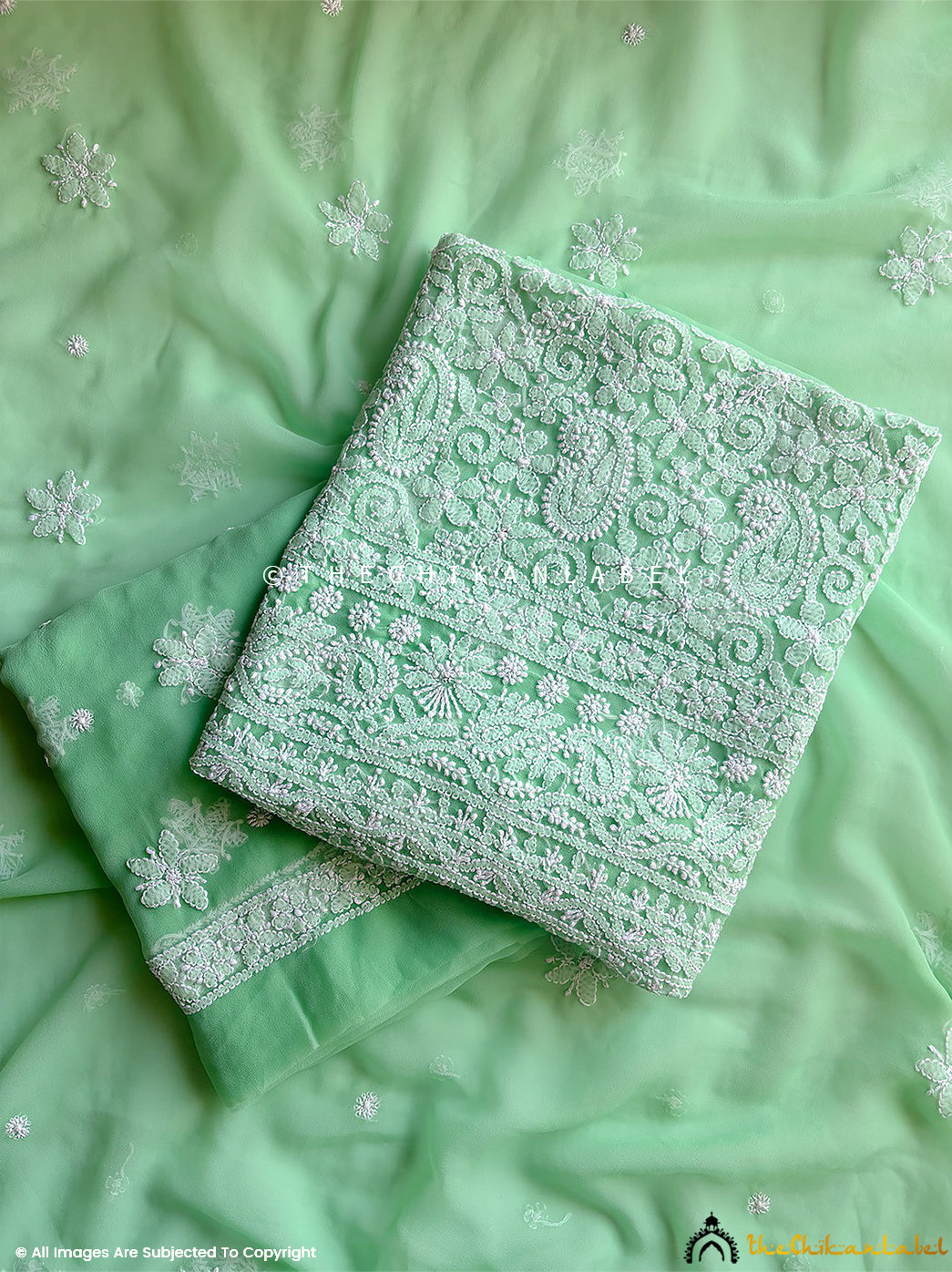 “Unstitched georgette chikankari suit piece with dupatta featuring traditional hand embroidery and floral motifs”