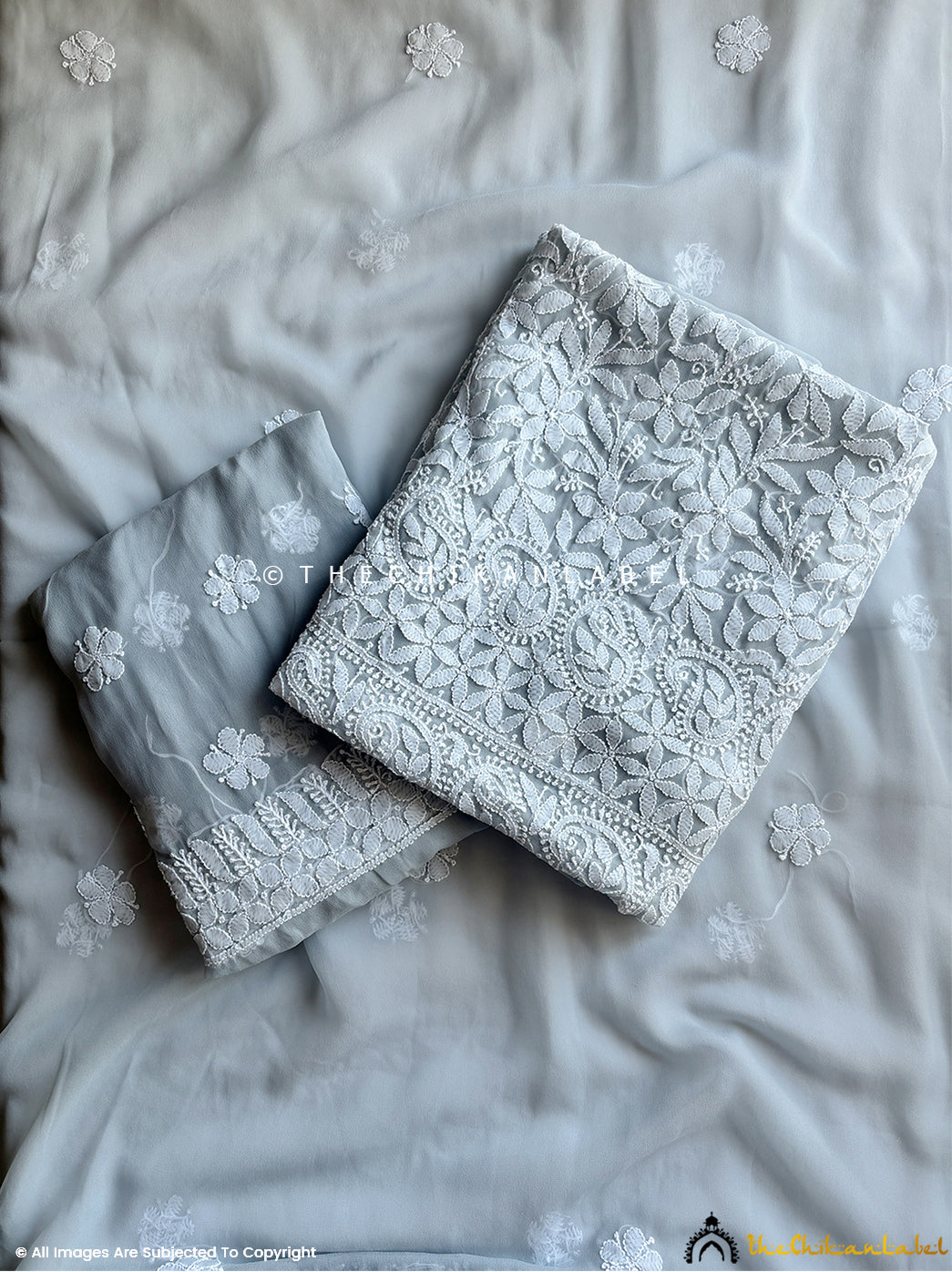 “Unstitched georgette chikankari suit piece with dupatta featuring traditional hand embroidery and floral motifs”