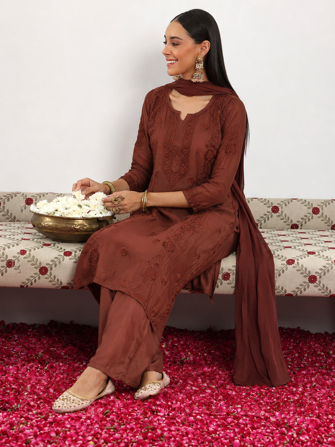 Trending muslin kurta set for women featuring delicate embroidered motifs, straight-cut kurti, relaxed palazzo and matching dupatta for everyday ethnic styling.