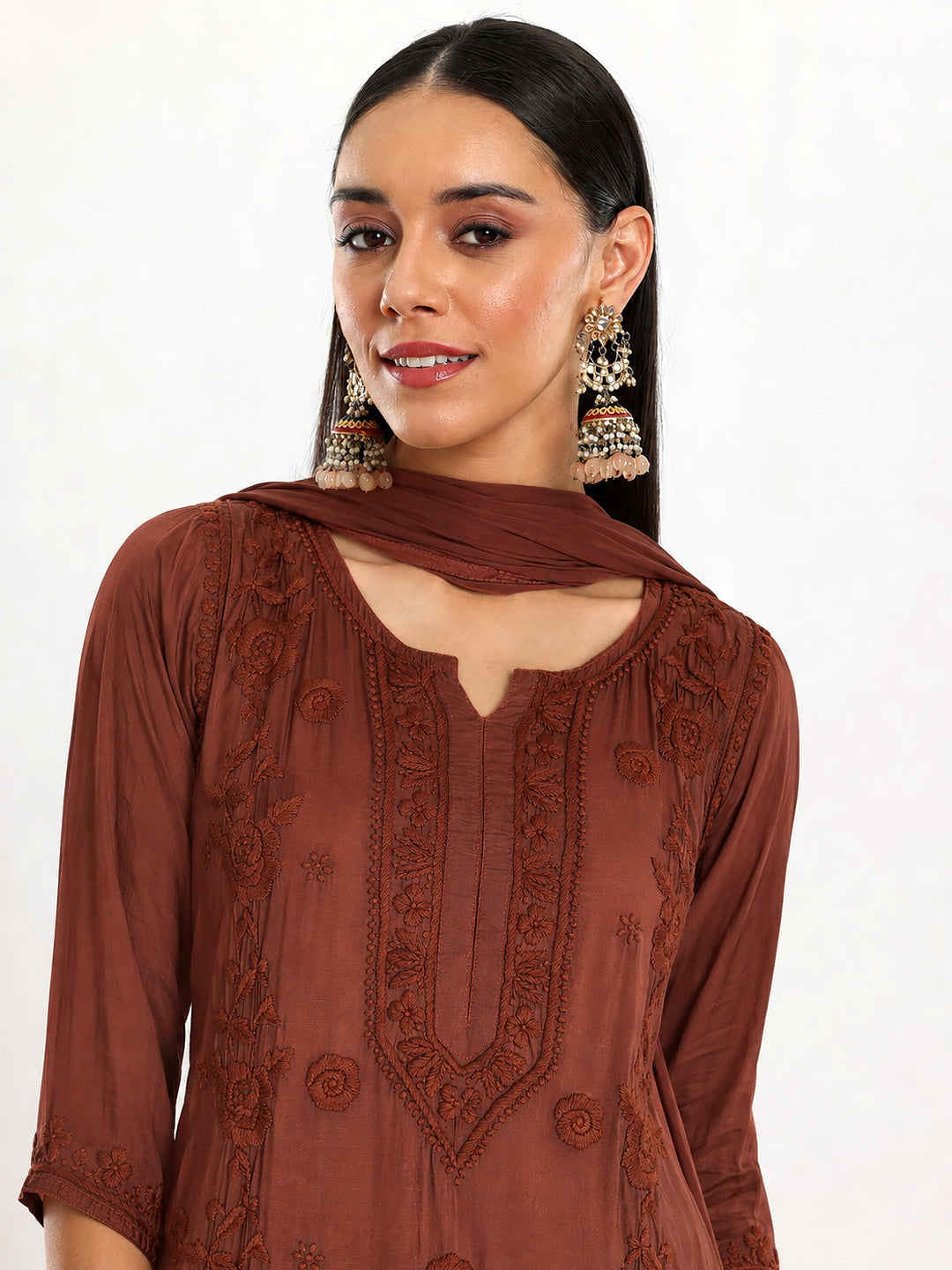 Women’s Ishita Muslin Kurti Palazzo Set with Dupatta showcasing intricate floral embroidery, three-quarter sleeves and a relaxed silhouette suitable for regular and festive wear.