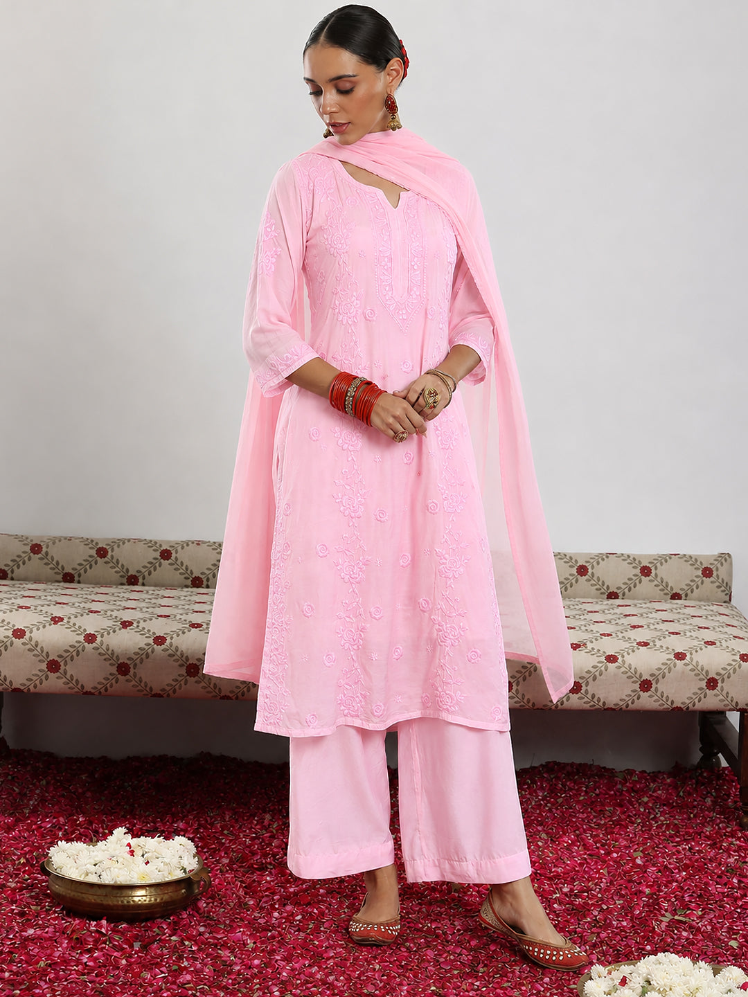 Comfortable regular wear set for women featuring the Muslin Chikankari kurta with traditional embroidery, matching bottoms and a lightweight coordinated dupatta.