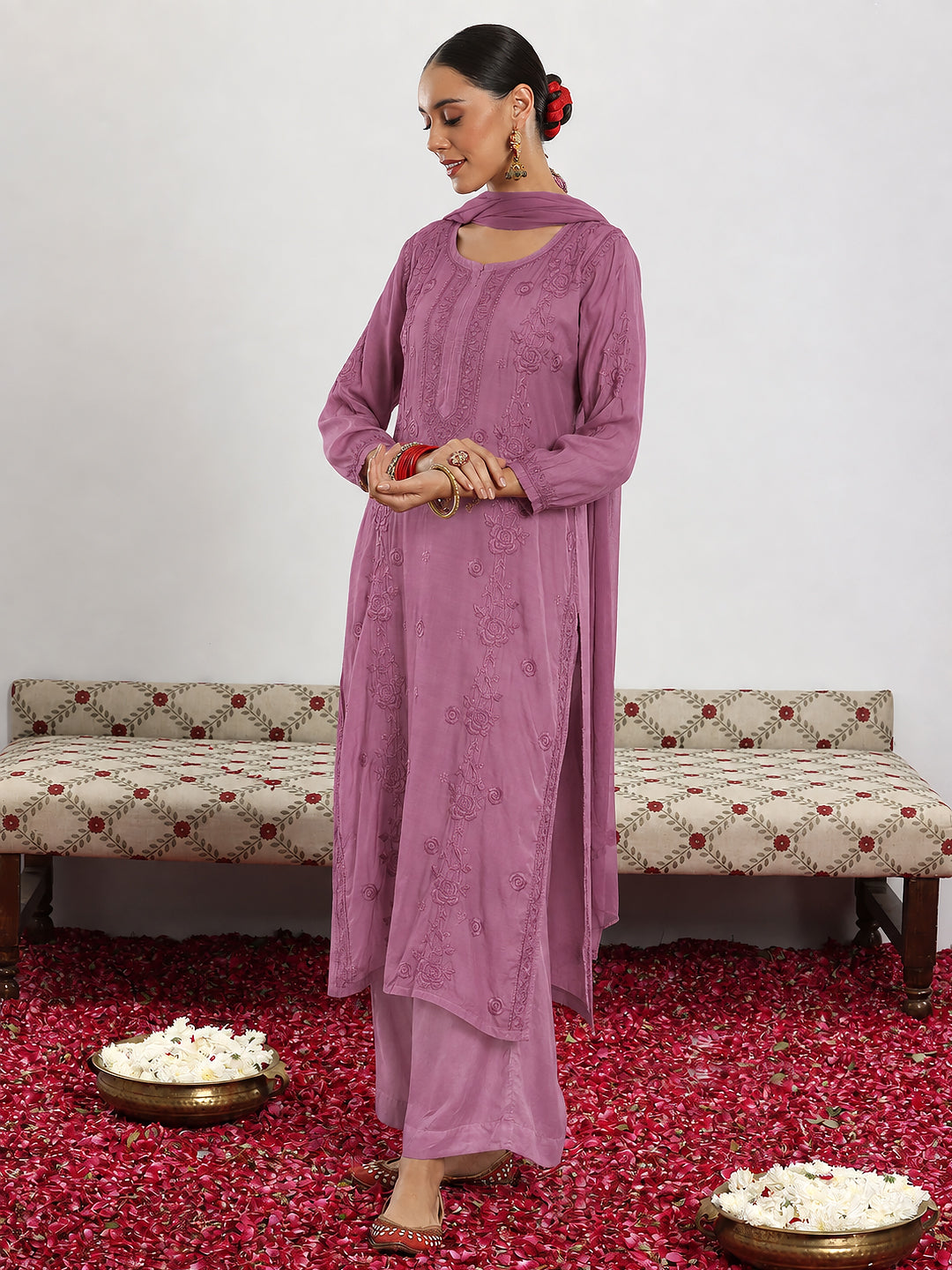 Women’s comfortable muslin kurta set with detailed Chikankari embroidery, straight silhouette, coordinated bottoms and dupatta for effortless everyday ethnic styling.