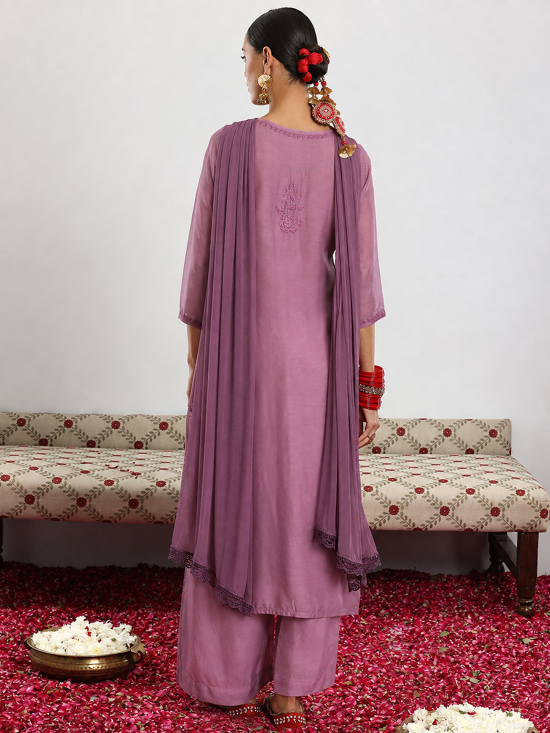 Traditional Chikankari muslin set featuring delicate floral embroidery on a straight-cut kurta paired with comfortable matching palazzo pants and a flowing dupatta.