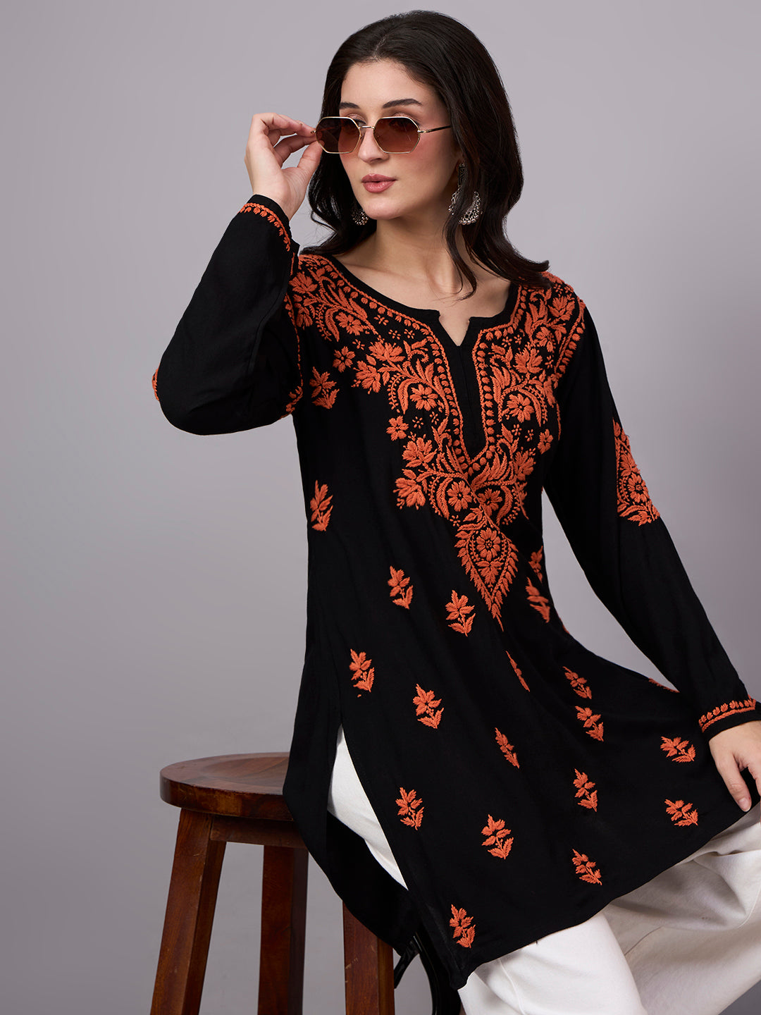 Comfortable regular wear top featuring authentic handcrafted Chikankari embroidery, lightweight rayon fabric, and a trendy short kurti design for effortless styling.