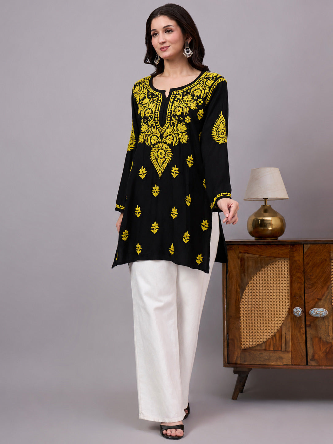 Comfortable regular wear top featuring authentic handcrafted Chikankari embroidery, lightweight rayon fabric, and a trendy short kurti design for effortless styling.