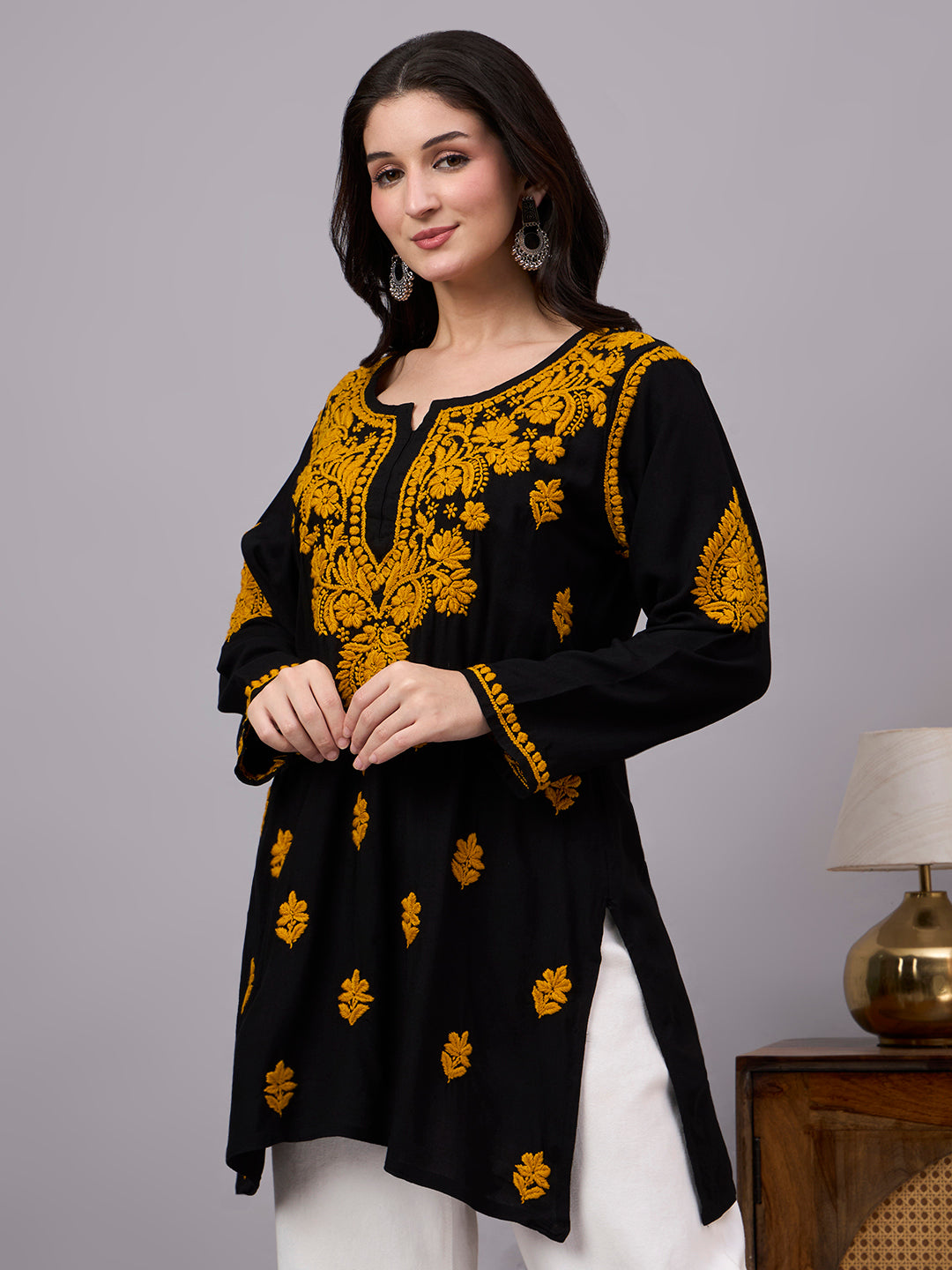 Traditional Rayon Short Kurta with artisan-made Chikankari embroidery, soft fabric texture, and contemporary ethnic style for modern women's wardrobes.
