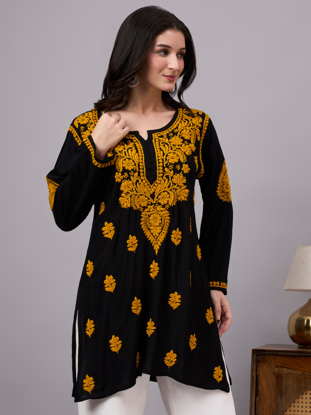 Stylish trending short kurti crafted with premium rayon fabric and handcrafted Lucknow Chikankari work, perfect for daily wear, travel, and casual occasions.