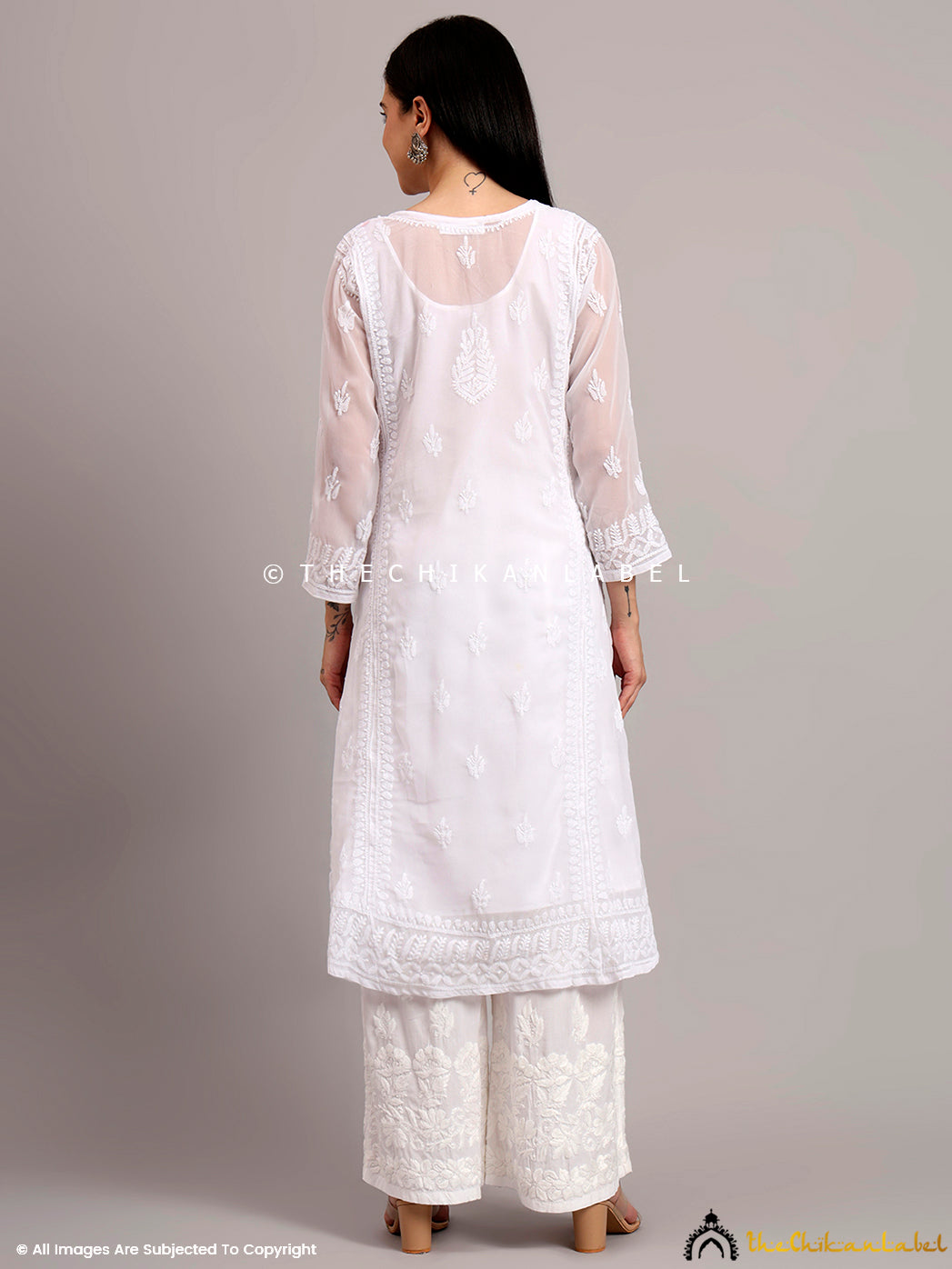 Traditional Angrakha silhouette in georgette with fine Chikankari work, styled for modern casual wear appeal

