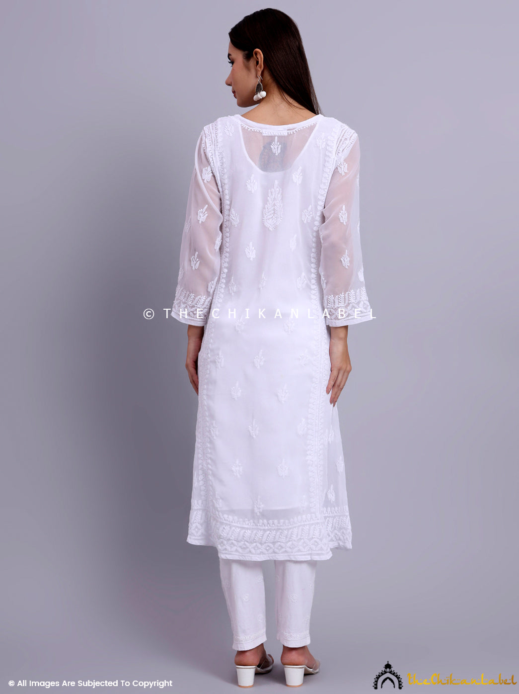 Chikankari wrap kurti in lightweight georgette designed with paisley and floral motifs for festive elegance.

