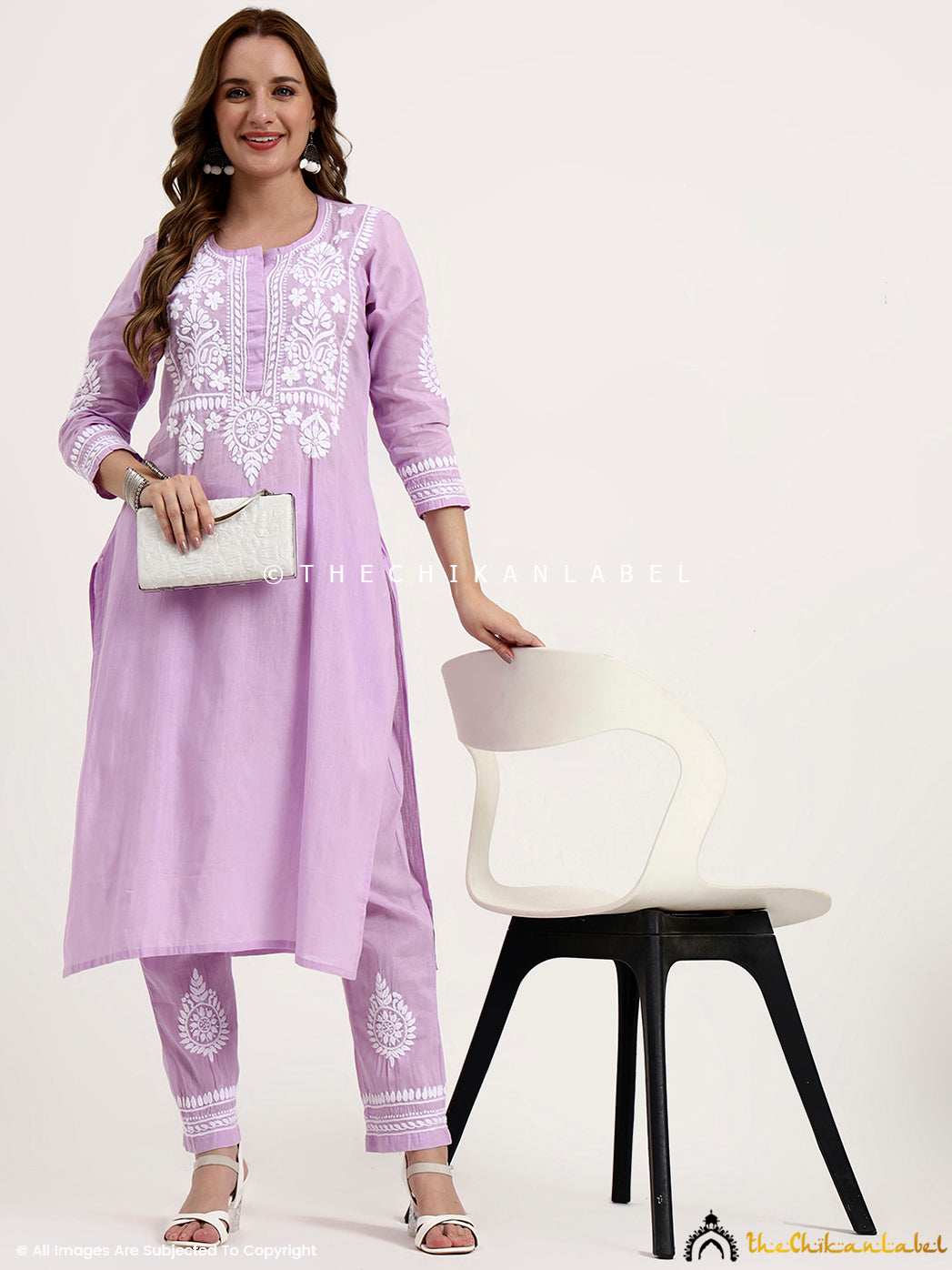 Premium khadi cotton chikankari set featuring straight-fit kurta and embroidered pants for elegant ethnic wear.