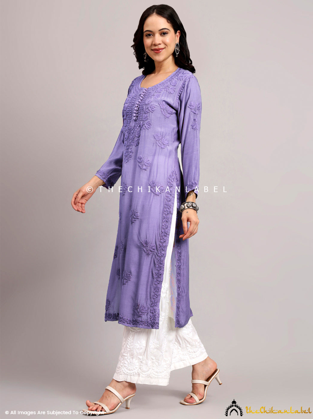 Trendy ethnic wear kurti with Lucknowi hand embroidery showcasing traditional patterns for cultural events or office wear.

