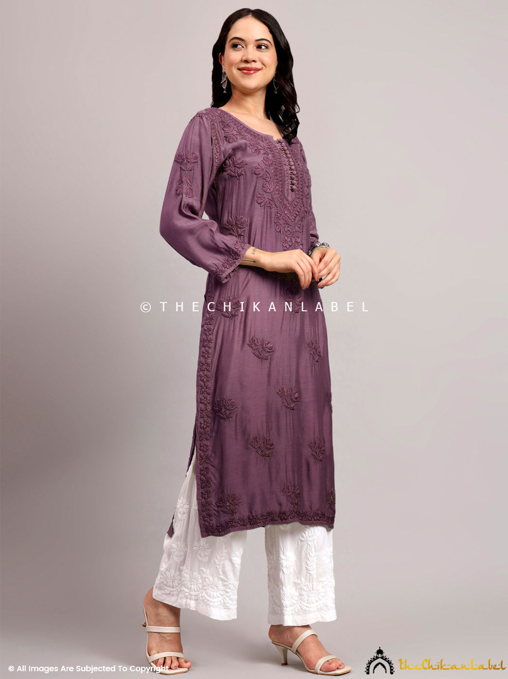 Designer chikankari kurti with detailed front placket buttons and handcrafted motifs perfect for formal and semi-formal occasions.

