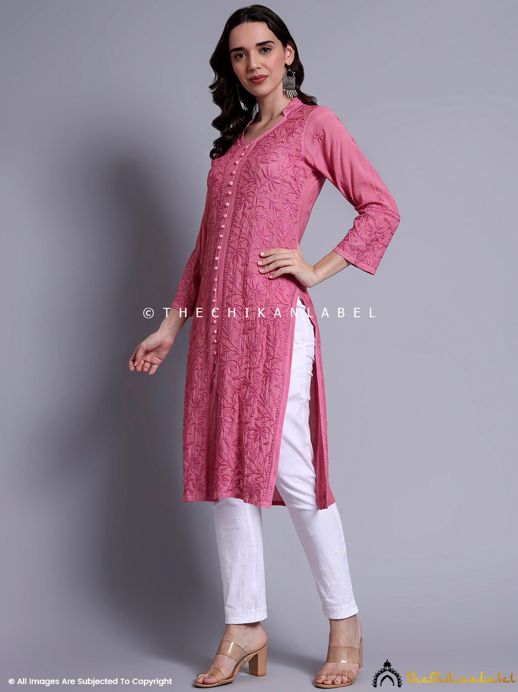 Stylish Chikankari straight kurti designed in soft muslin fabric with artisan embroidery and center slit.

