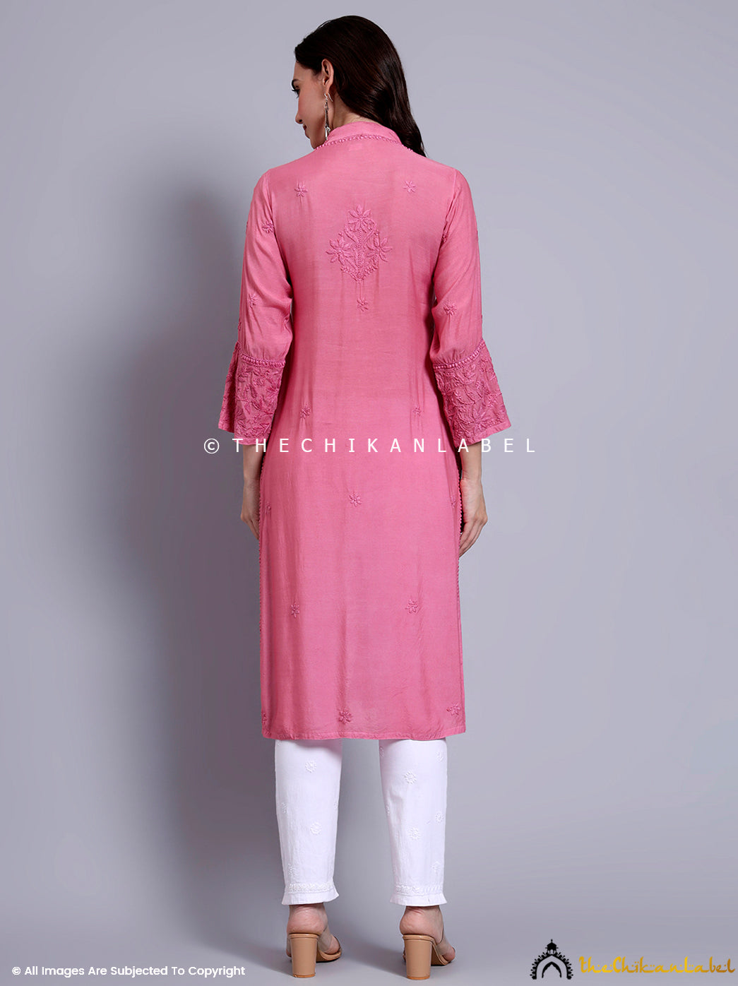 Full-length image showcasing detailed embroidery work on muslin Chikankari kurti paired with straight pants.

