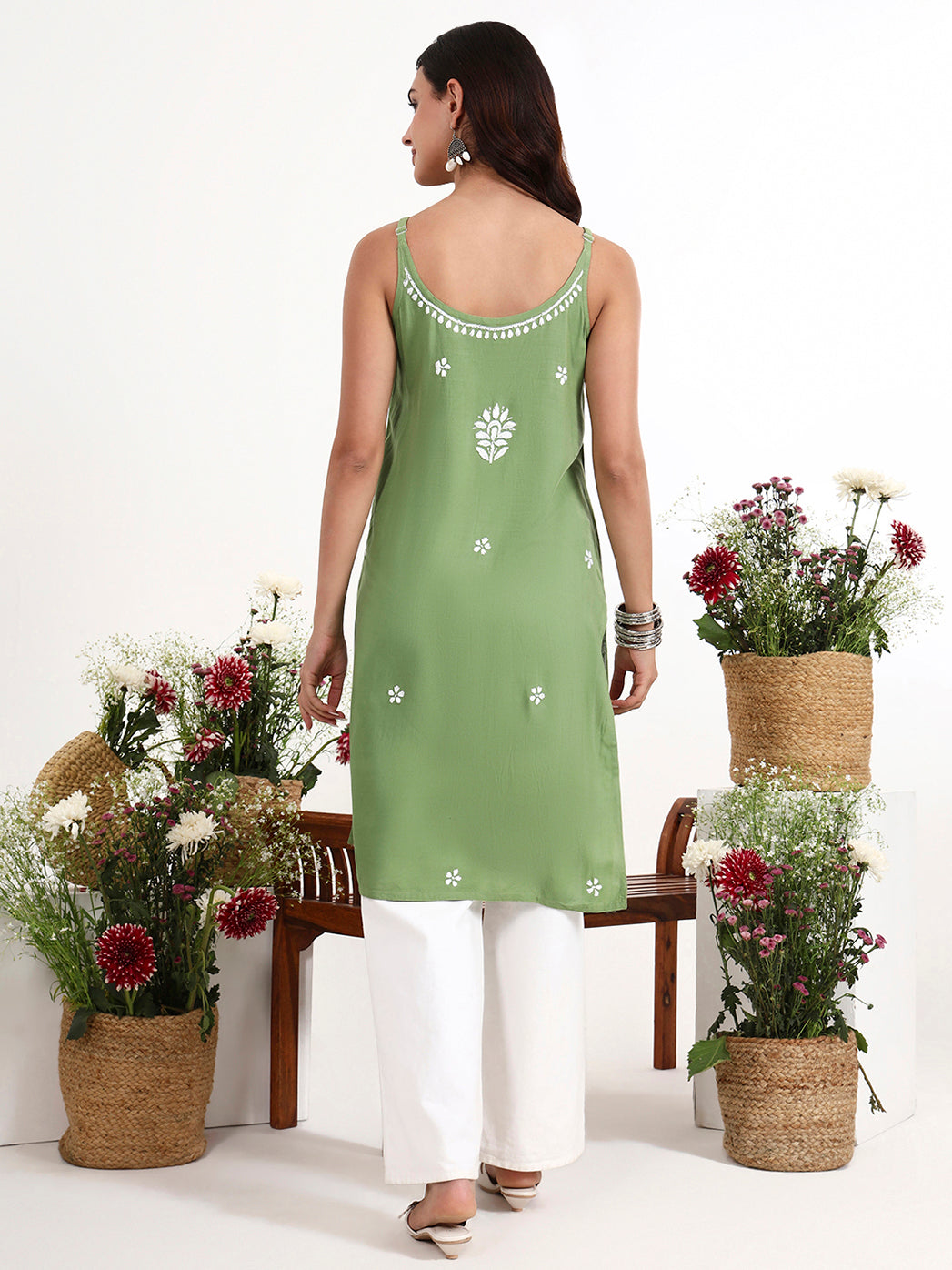 Elegant chikankari strappy kurta featuring detailed neckline embroidery and long straight cut