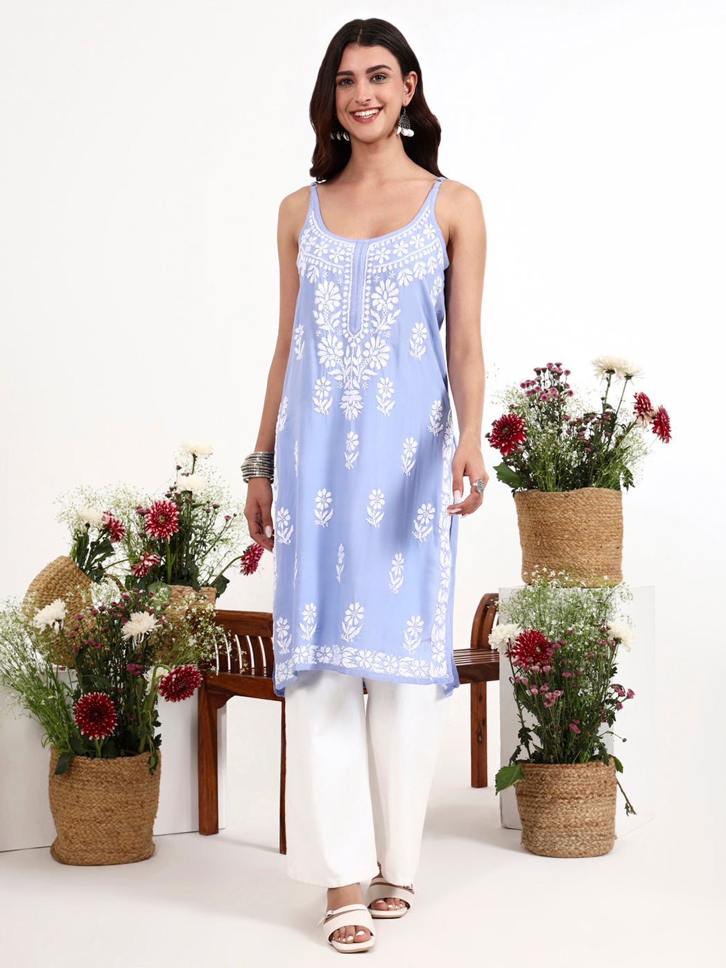 Women wearing chikankari strappy kurta with detailed floral embroidery and modern silhouette