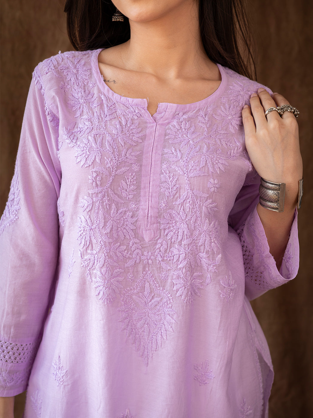 Traditional chikankari kurti showcasing delicate embroidery patterns, worn with flowing farshi salwar for festive and cultural occasions