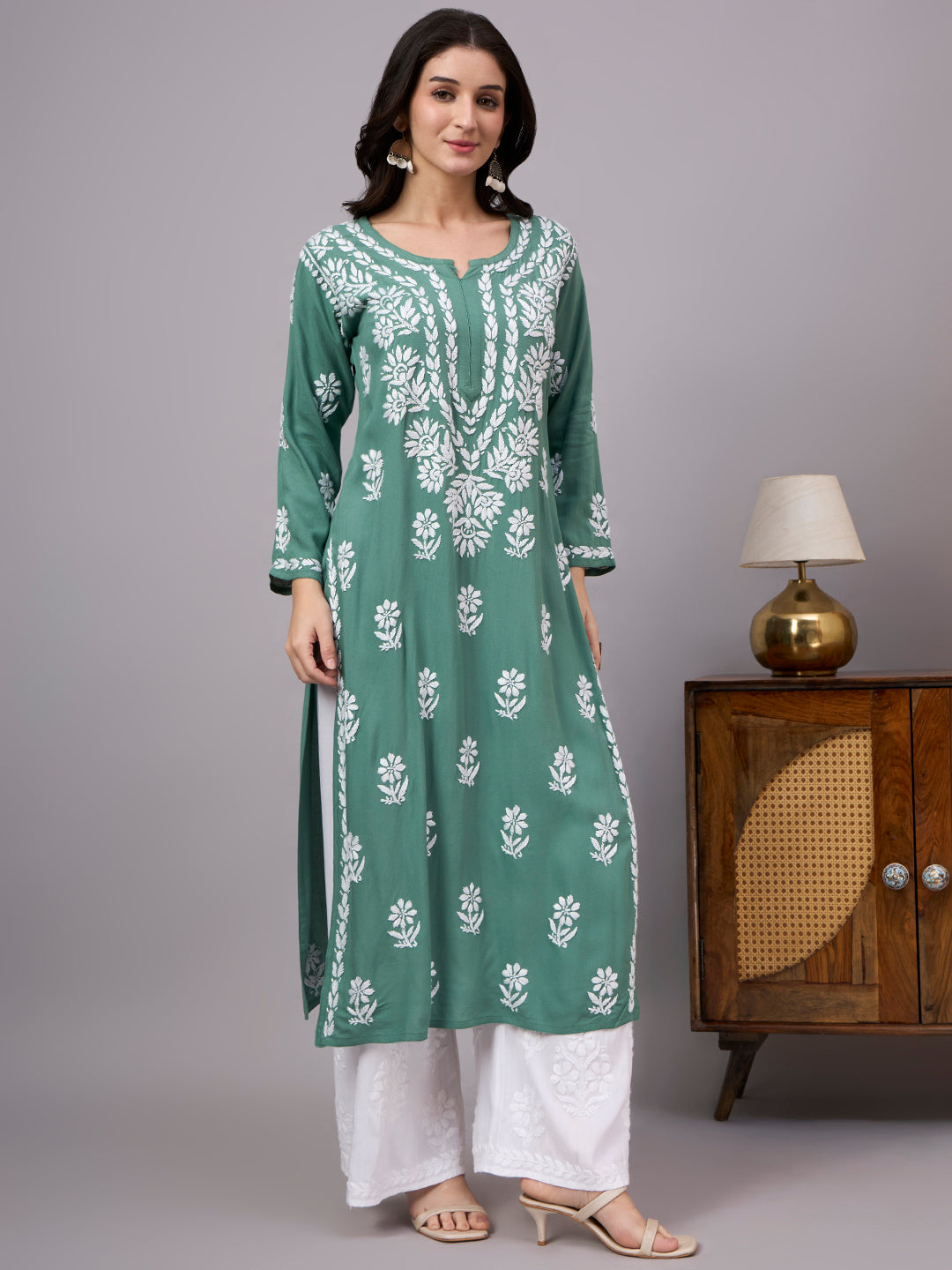 Handcrafted Chikankari Kurta for women featuring intricate artisan embroidery, breathable rayon fabric, full sleeves, and elegant straight-cut styling for effortless comfort.