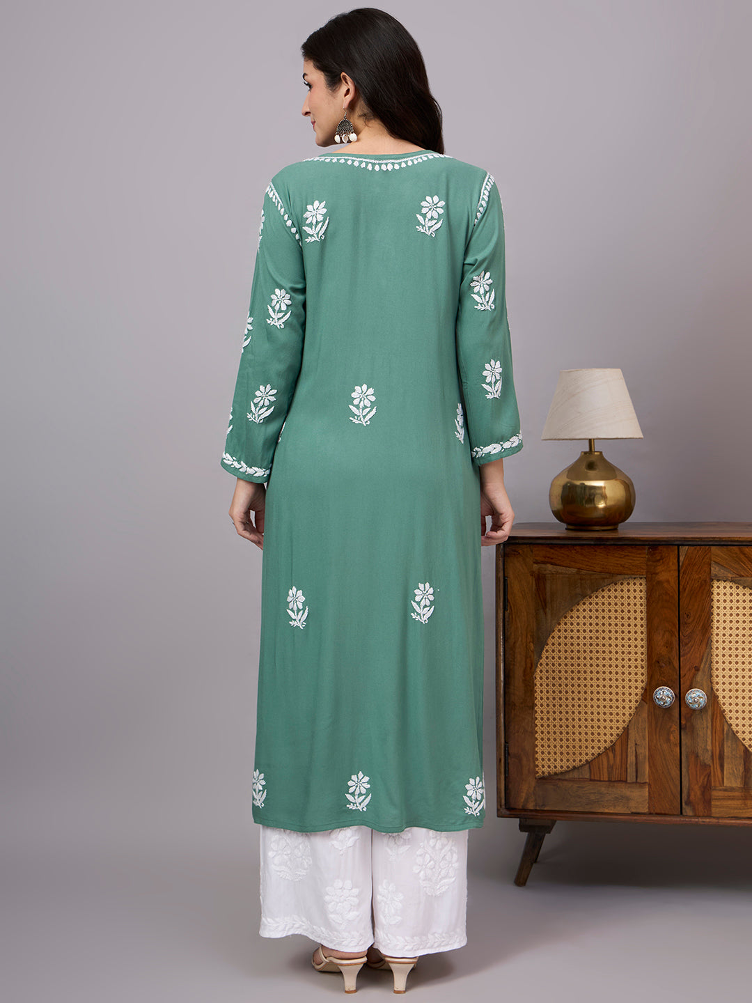 Women's trending kurti featuring authentic Lucknow Chikankari embroidery, soft rayon construction, straight silhouette, and versatile styling for every occasion.