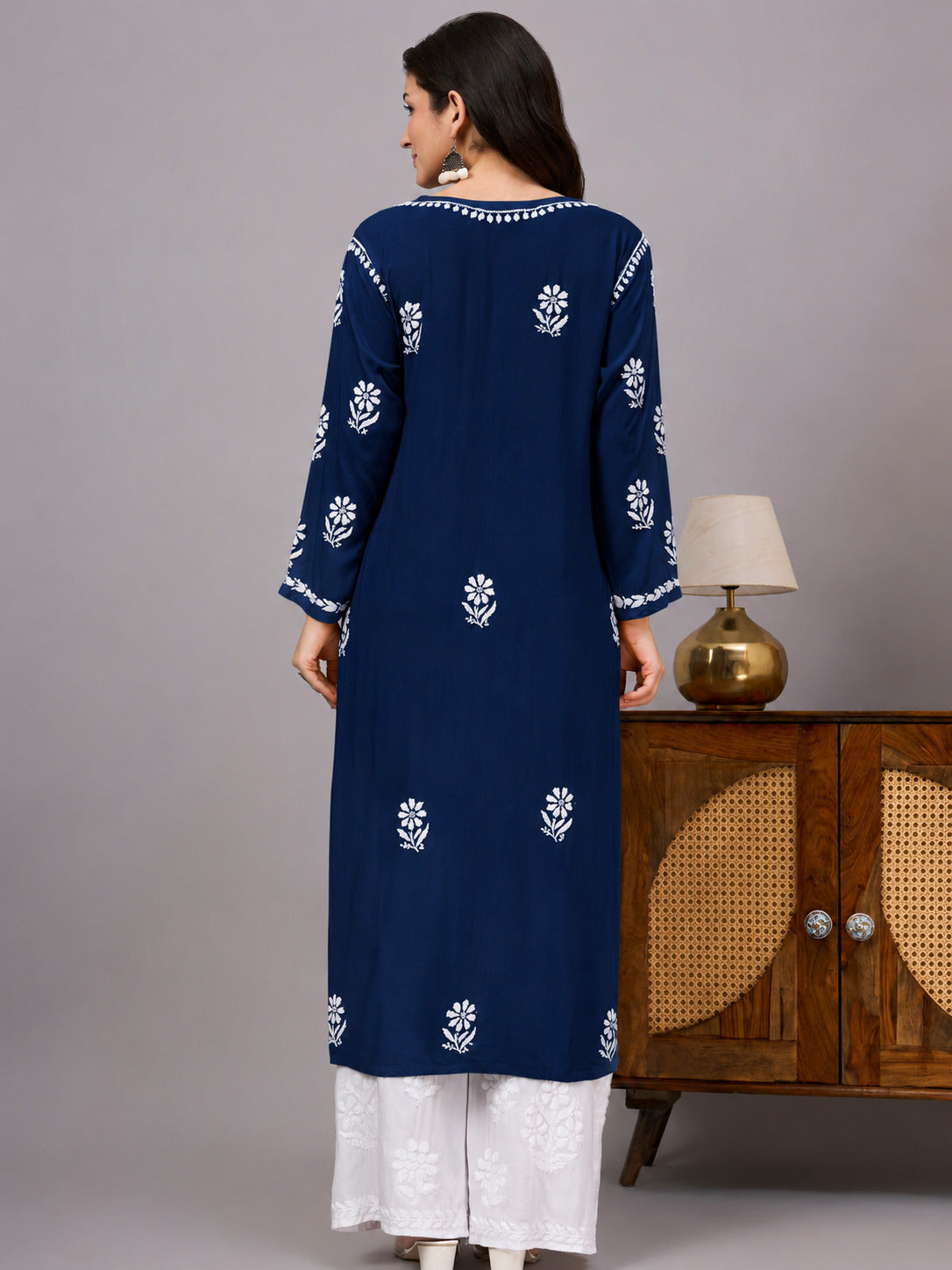 Traditional Rayon Straight Kurti crafted by skilled artisans with authentic Chikankari embroidery, offering breathable comfort, elegant styling, and versatile ethnic fashion for women.