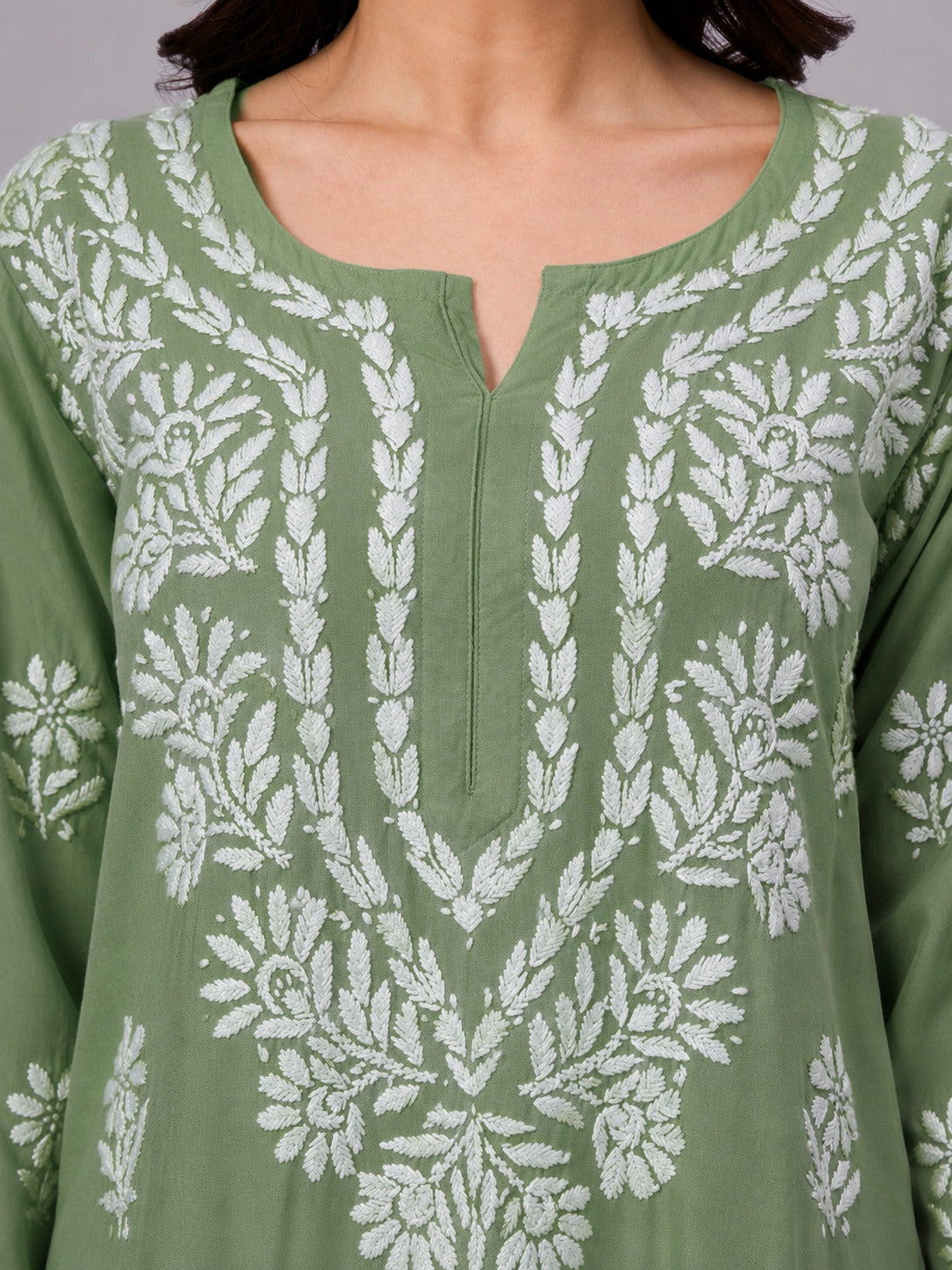 Women's ethnic Rayon Straight Kurti featuring traditional Lucknow Chikankari craftsmanship, soft fabric, full sleeves, and graceful straight-cut design for effortless elegance.