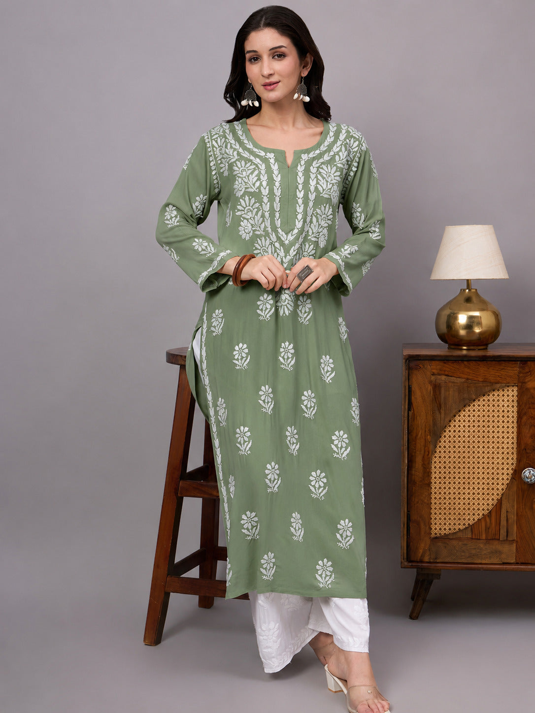 Stylish Rayon Straight Kurti with handcrafted Chikankari embroidery, comfortable regular fit, breathable fabric, and classic ethnic appeal for women seeking timeless fashion.