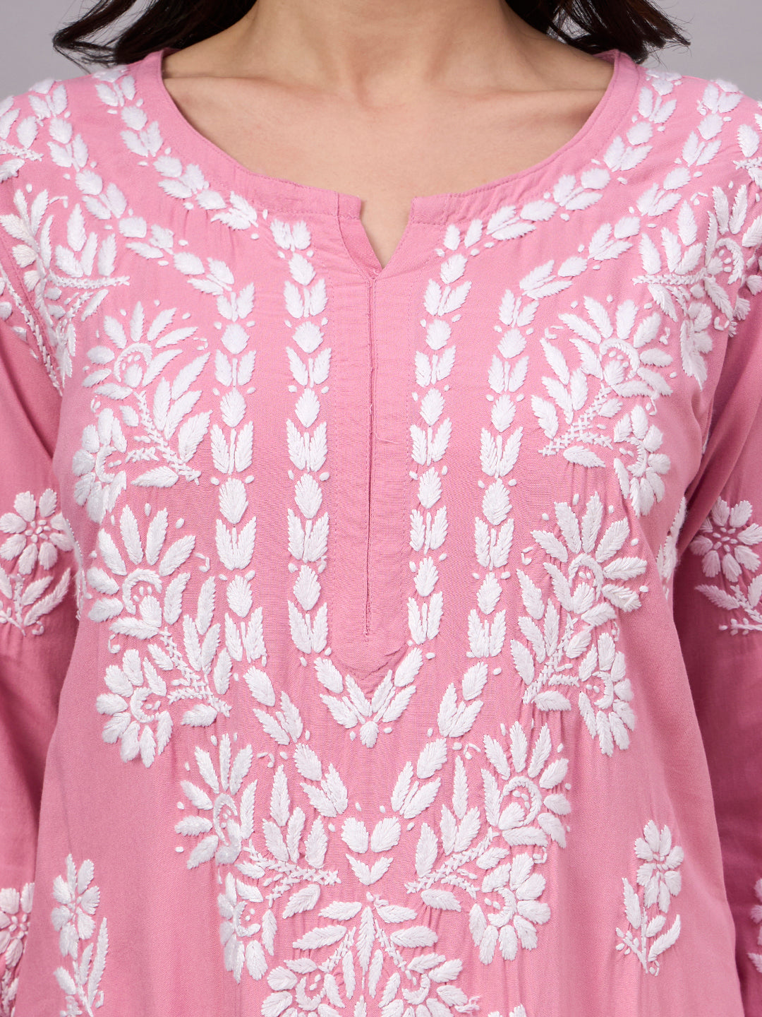 Comfortable regular wear kurti with handcrafted Chikankari embroidery, breathable rayon fabric, classic straight silhouette, and versatile styling for work, travel, and everyday fashion.