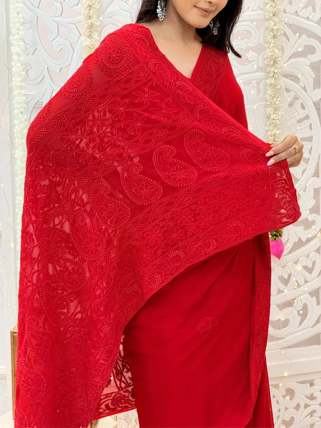 Handcrafted viscose chikankari saree showcasing delicate floral motifs and fine detailing by Lucknow artisans.