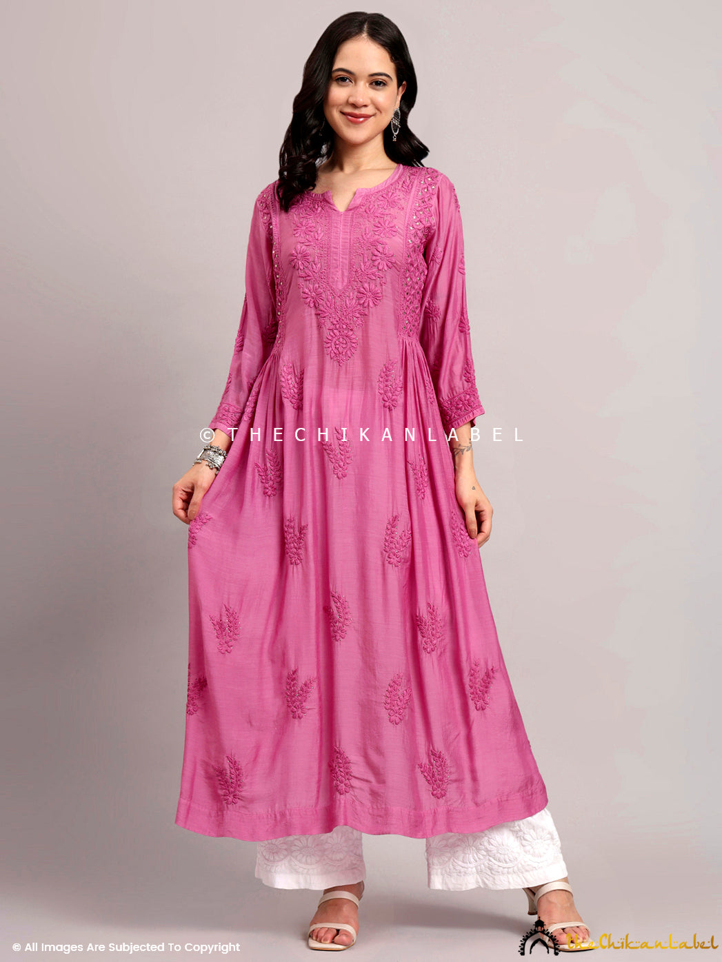 Model styling a flowy chikankari kurti perfect for summer events or casual gatherings.