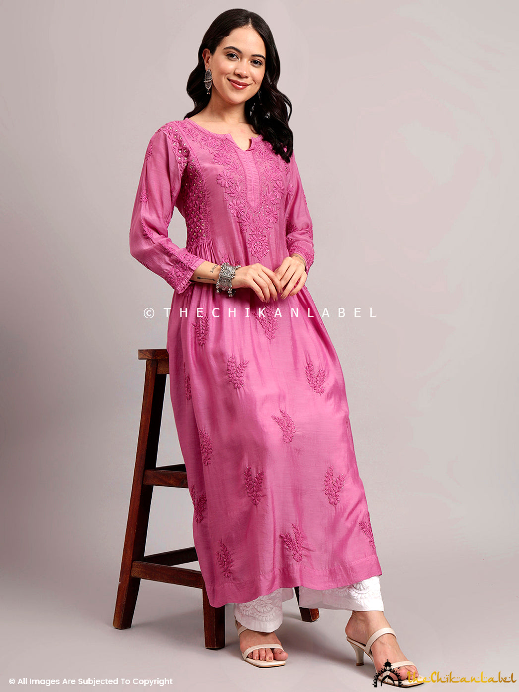 Fashion-forward look featuring traditional Lucknowi embroidery on muslin base.