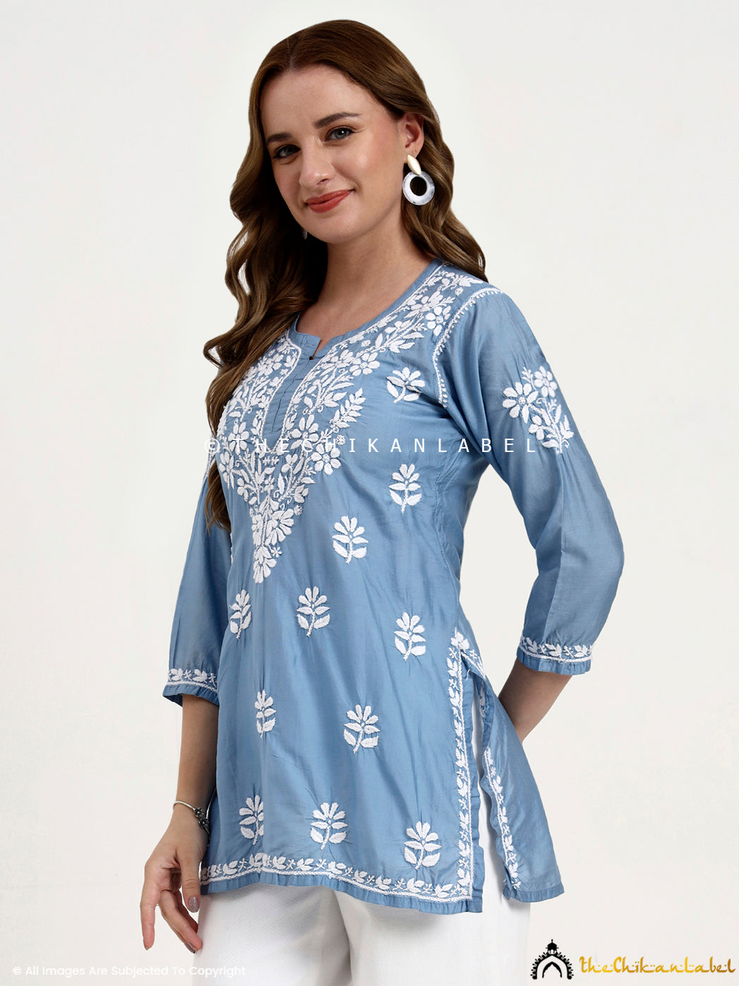 Semi-formal chikankari embroidered short kurti in Chanderi fabric for versatile ethnic styling.