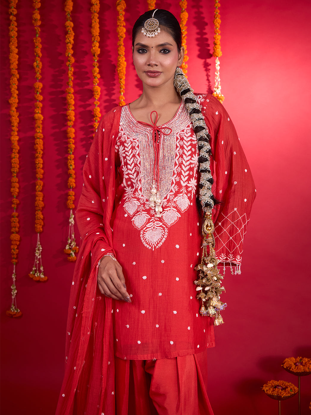 Festive Mul Chanderi kurta set with intricate neckline embroidery, scattered motifs across the kurta and a flowing dupatta with embroidered accents.