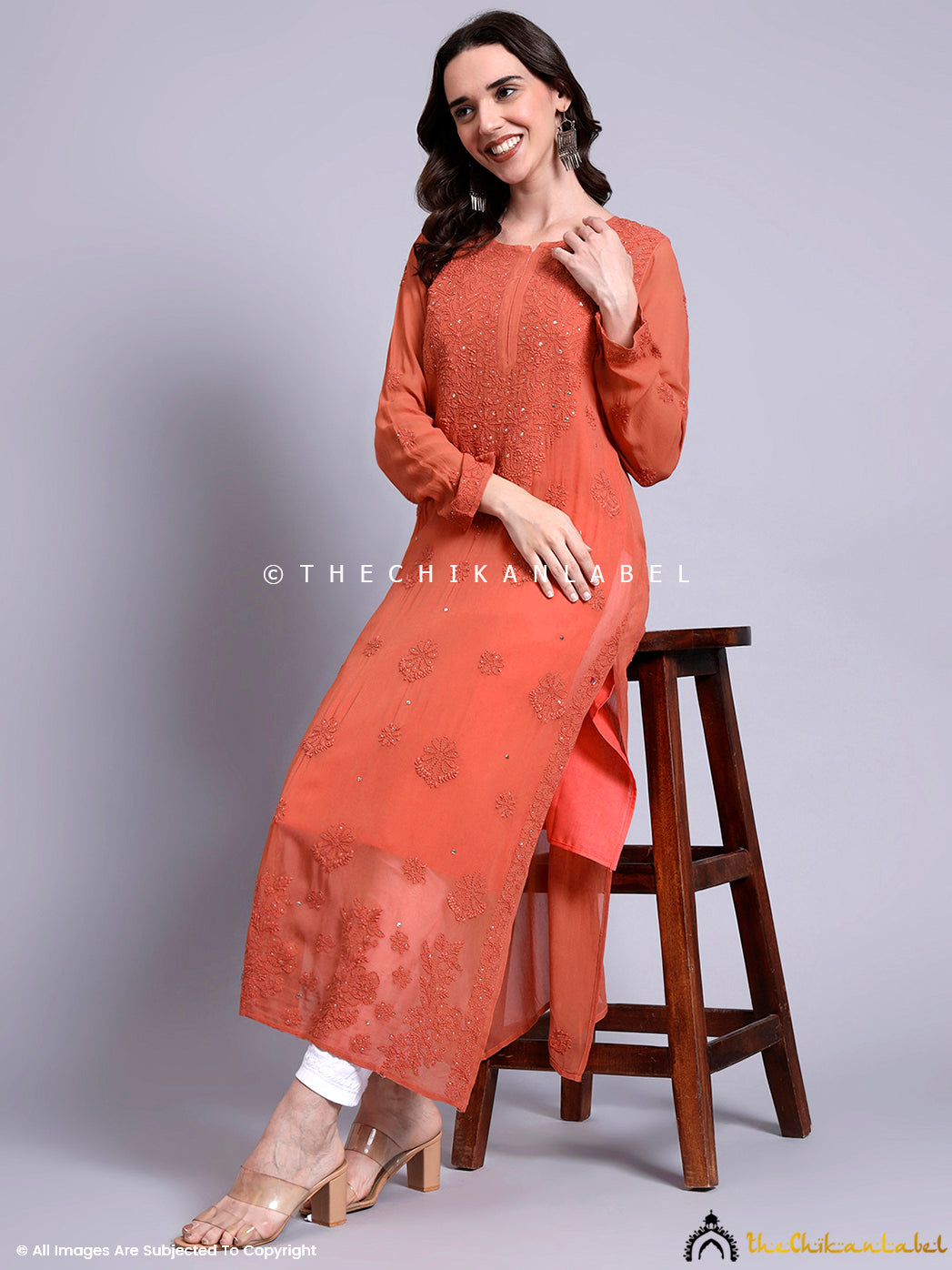 Model wearing embroidered viscose kurti with intricate chikankari detailing and elegant mukaish accents, paired with classic white palazzo pants

