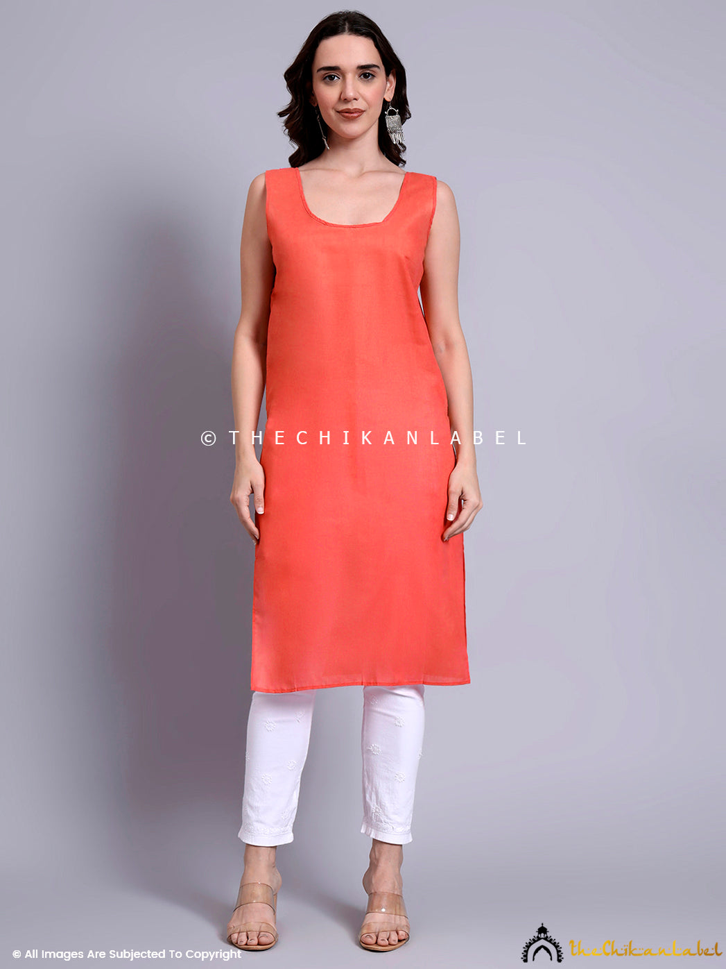 Straight fit kurti featuring symmetrical floral chikankari designs and shimmering mukaish embroidery across the chest and sleeves

