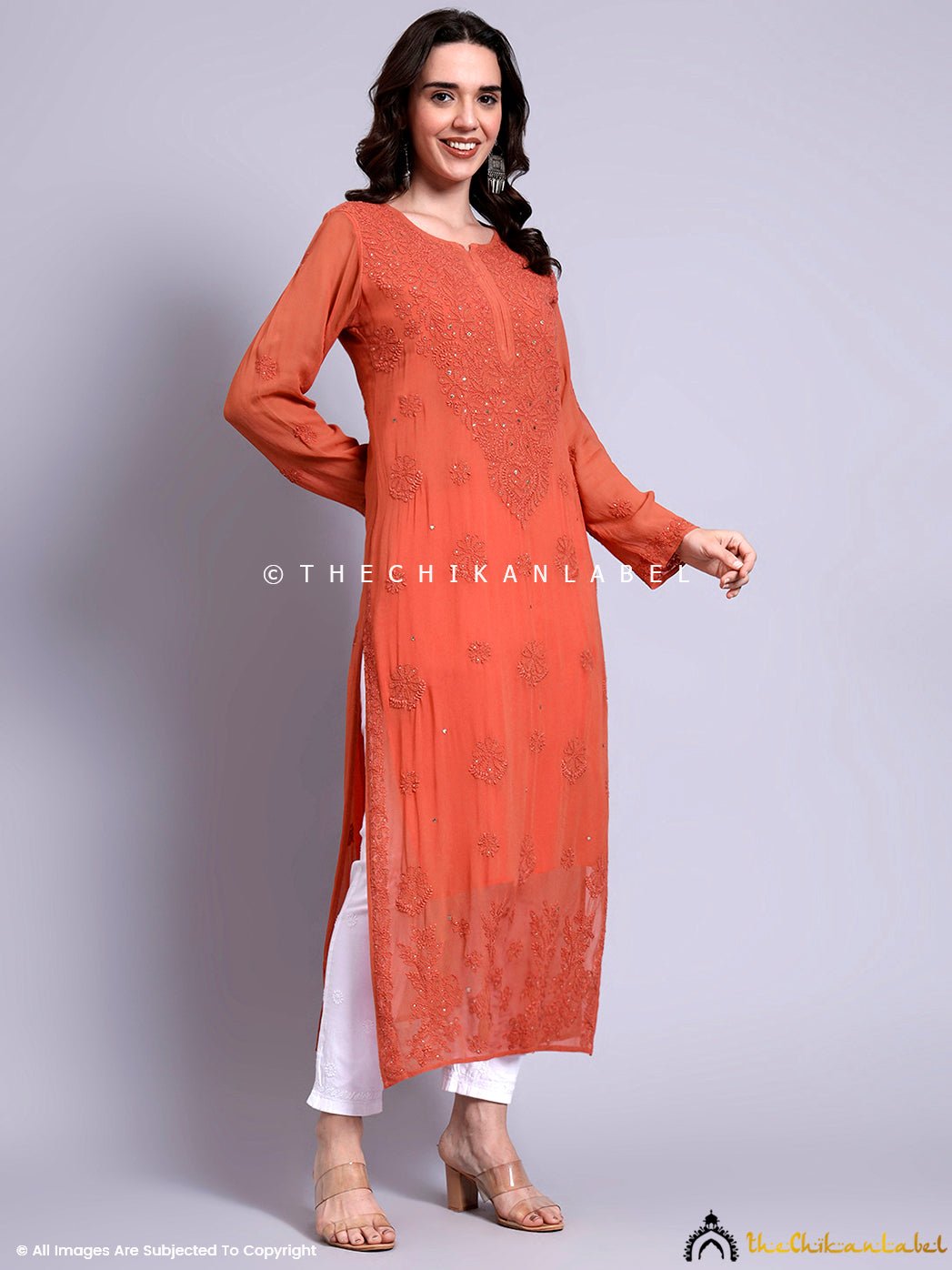 Traditional straight kurta design enhanced with mukaish work and detailed floral chikankari motifs perfect for festive and semi-formal occasions

